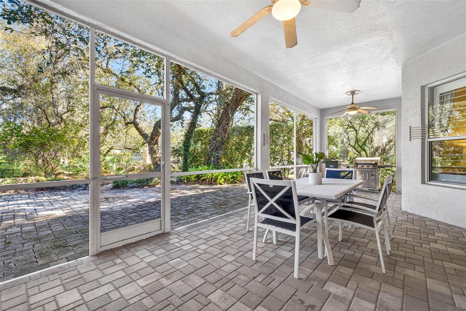 Screened lanai overlooking extended pavered area perfect for a firepit!