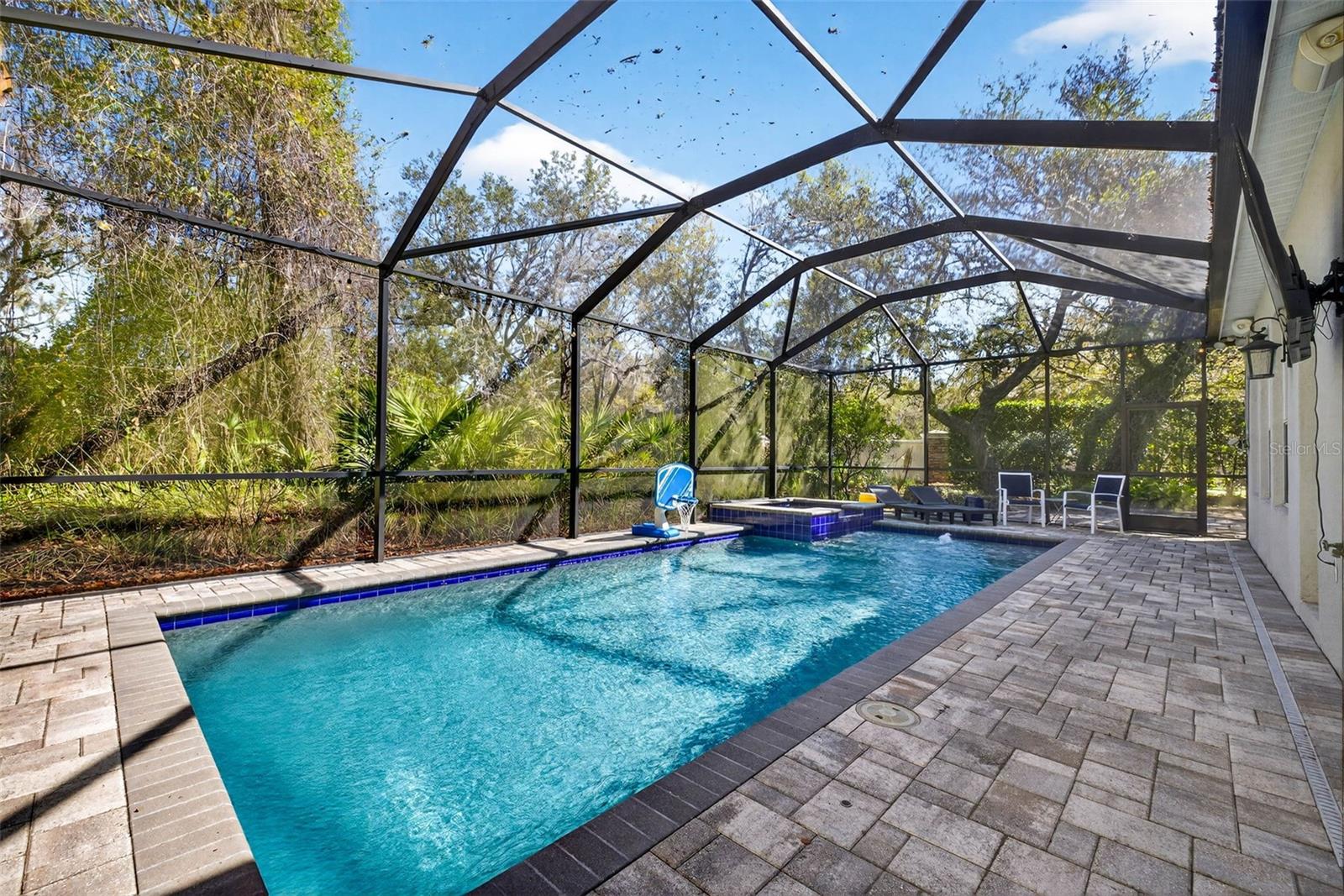 Large gas heated, salt water pool and spa with screened enclosure.