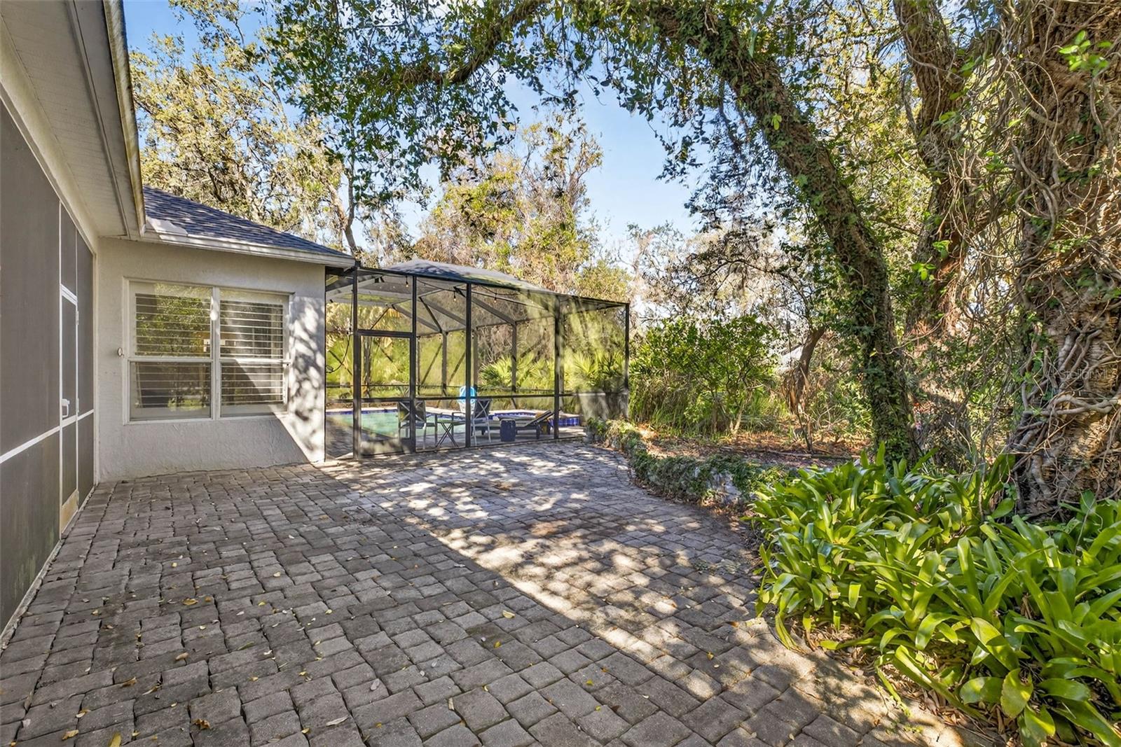 Pavered area to exterior access to pool area.