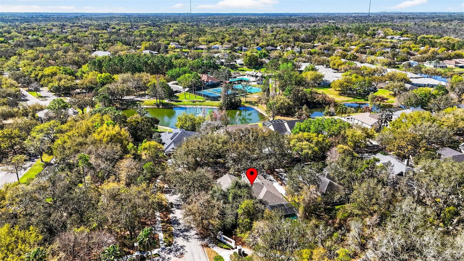 Home is noted in this overhead shot. Osprey Club, one of FishHawk Ranch's premiere amenities is in the distance.