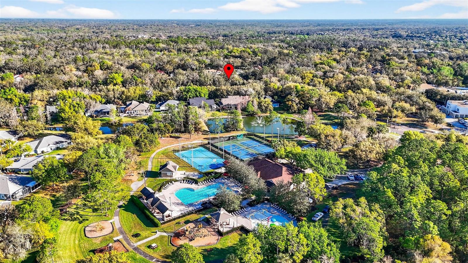 Home is marked with red balloon. Located adjacent to the Osprey Club that features a fitness center, splash pad, junior olympic swimming pool, basketball, tennis courts, a theatre, a gathering room for private rentals and hosues the resident services office.