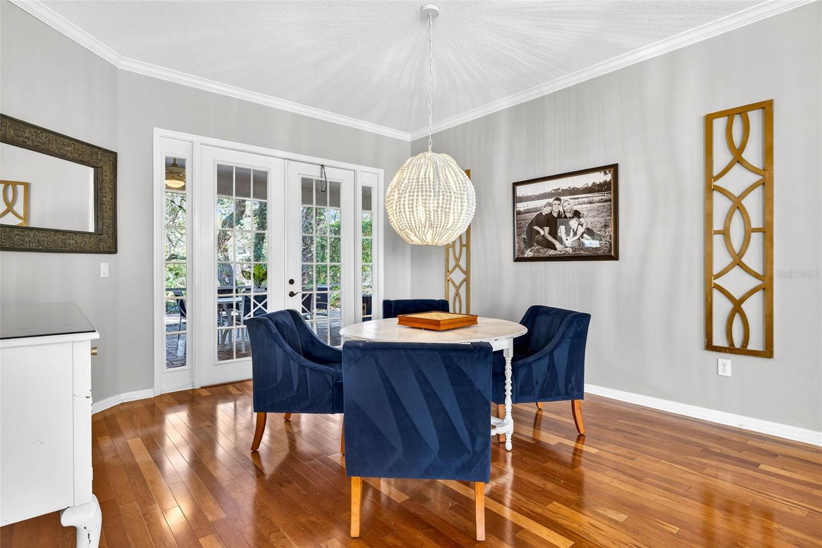 Fabulous lighting in this area with french doors to screened lanai