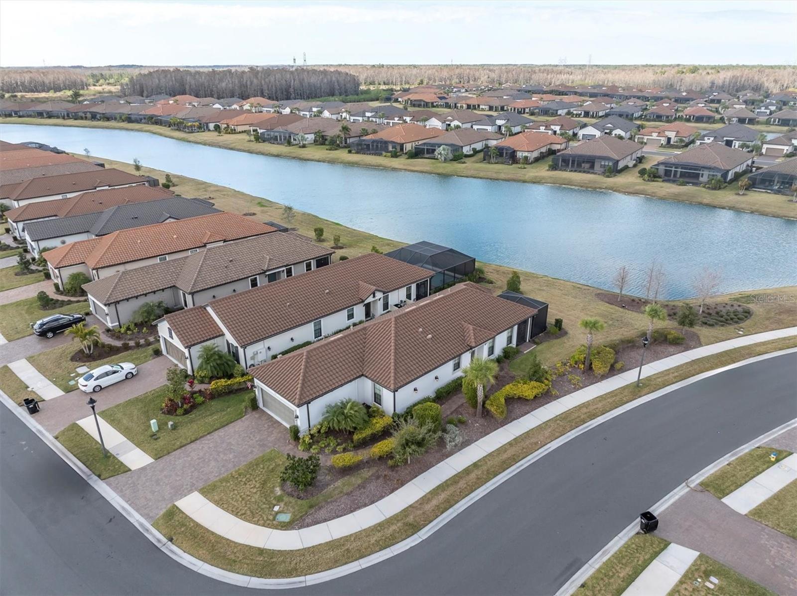 WELCOME HOME ~ DESIRABLE CORNER LOT FACING POND