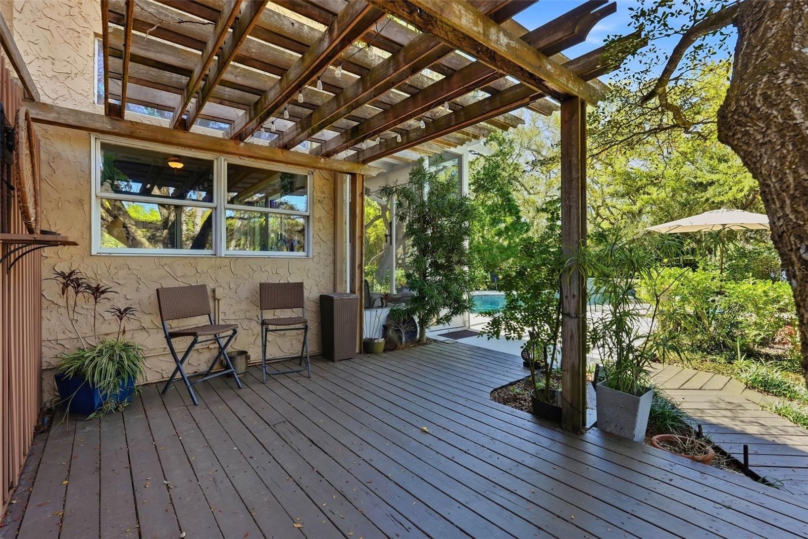 Pergola covered deck perfect for an outdoor kitchen