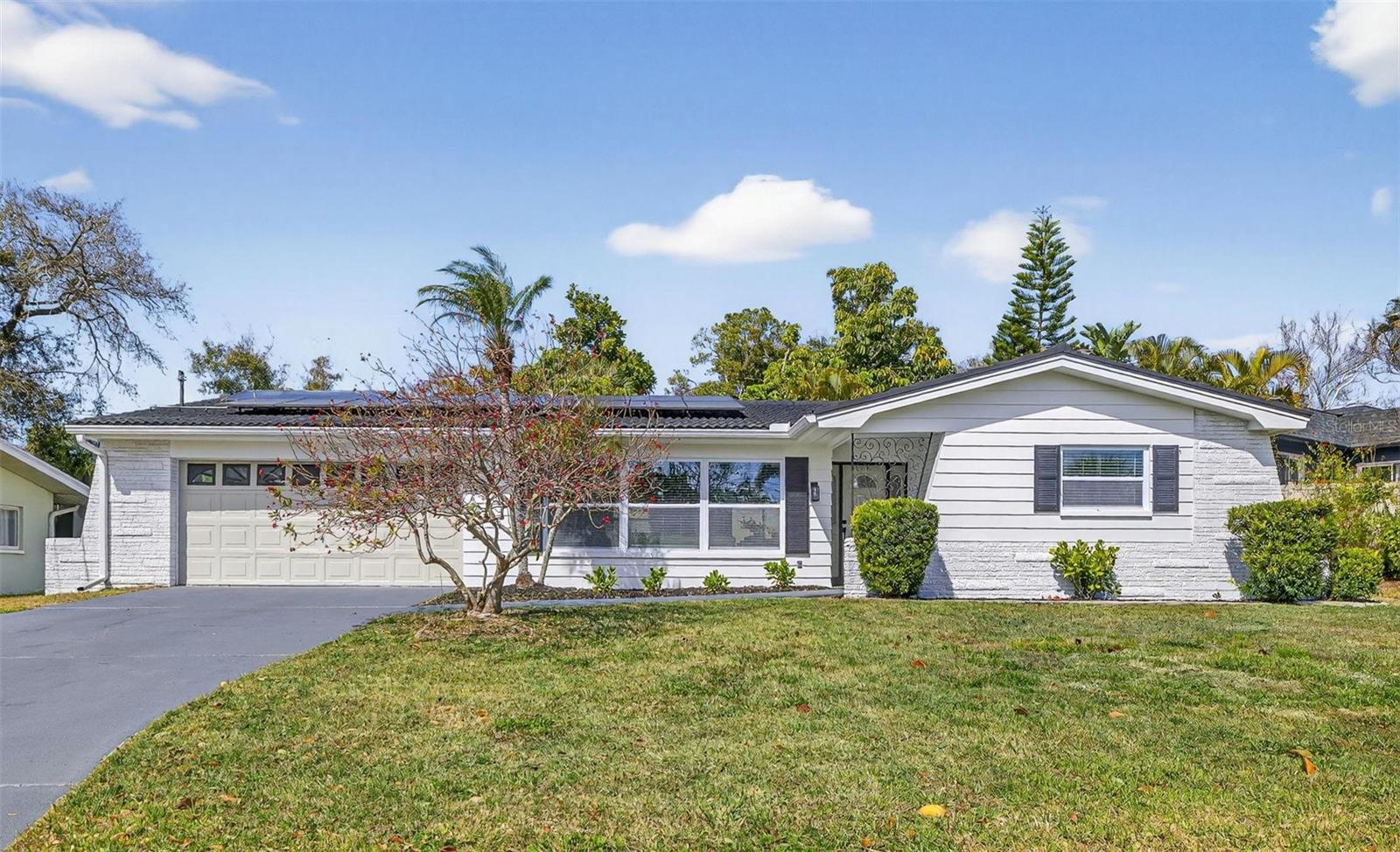 Exterior Front - 2 Car Garage and Long Driveway