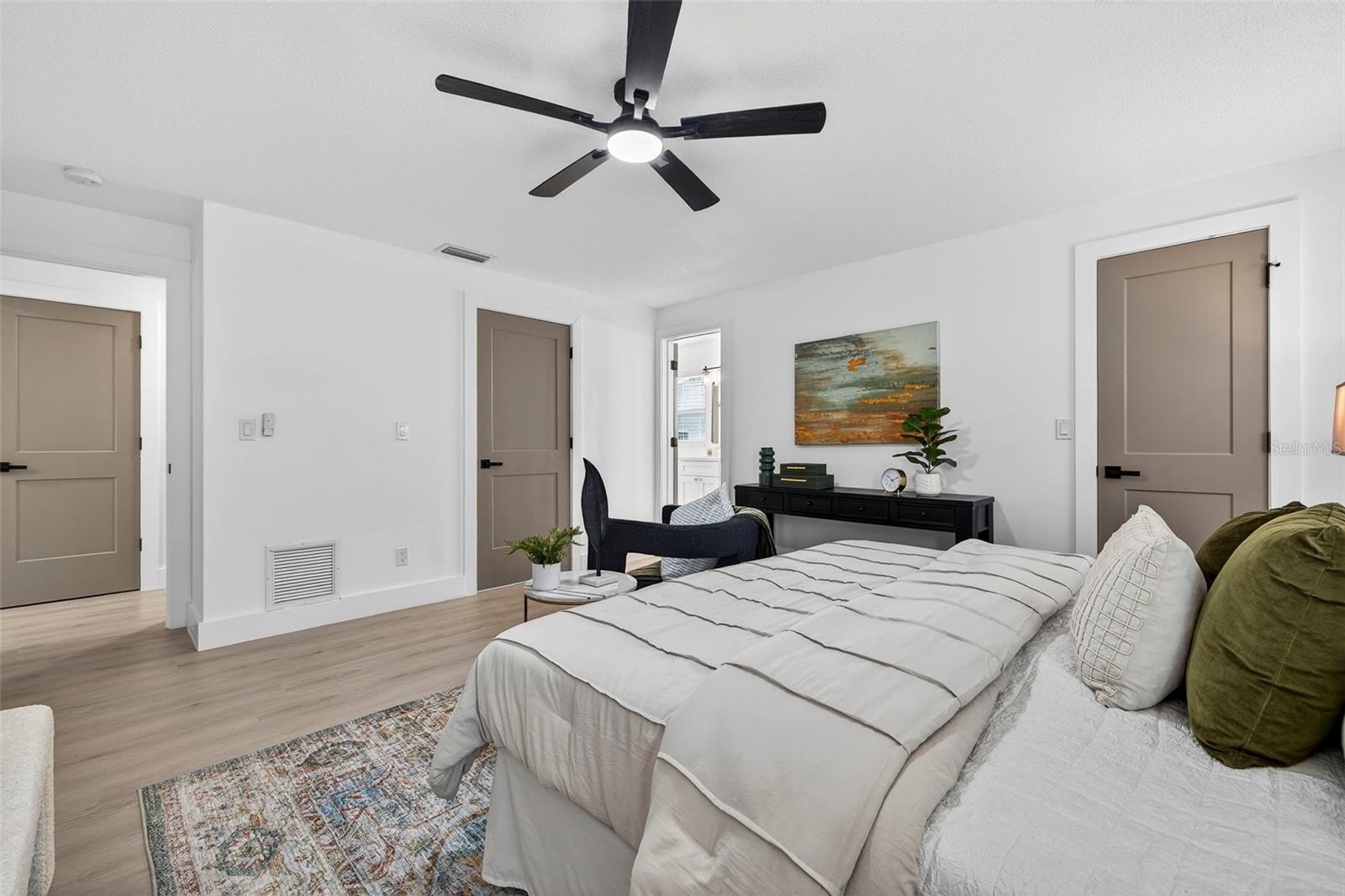 NEW LVP FLOORING and custom-painted doors create a polished, high-end feel.