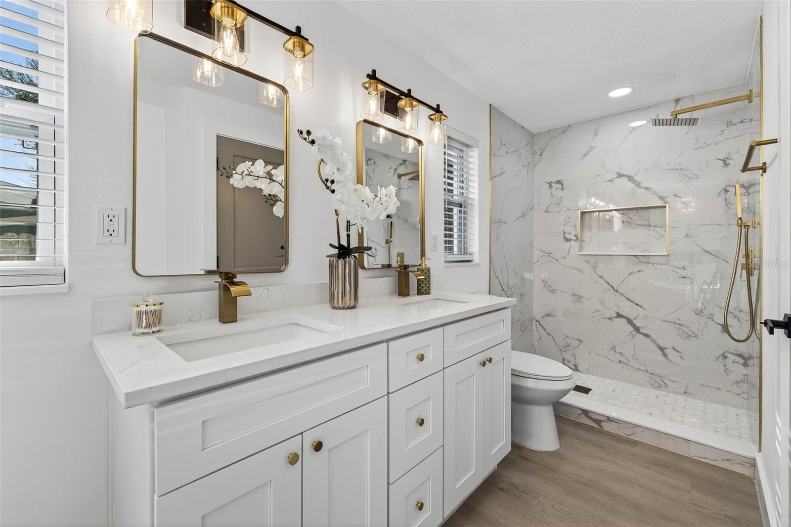 uxury meets functionality in this beautifully updated master bath.