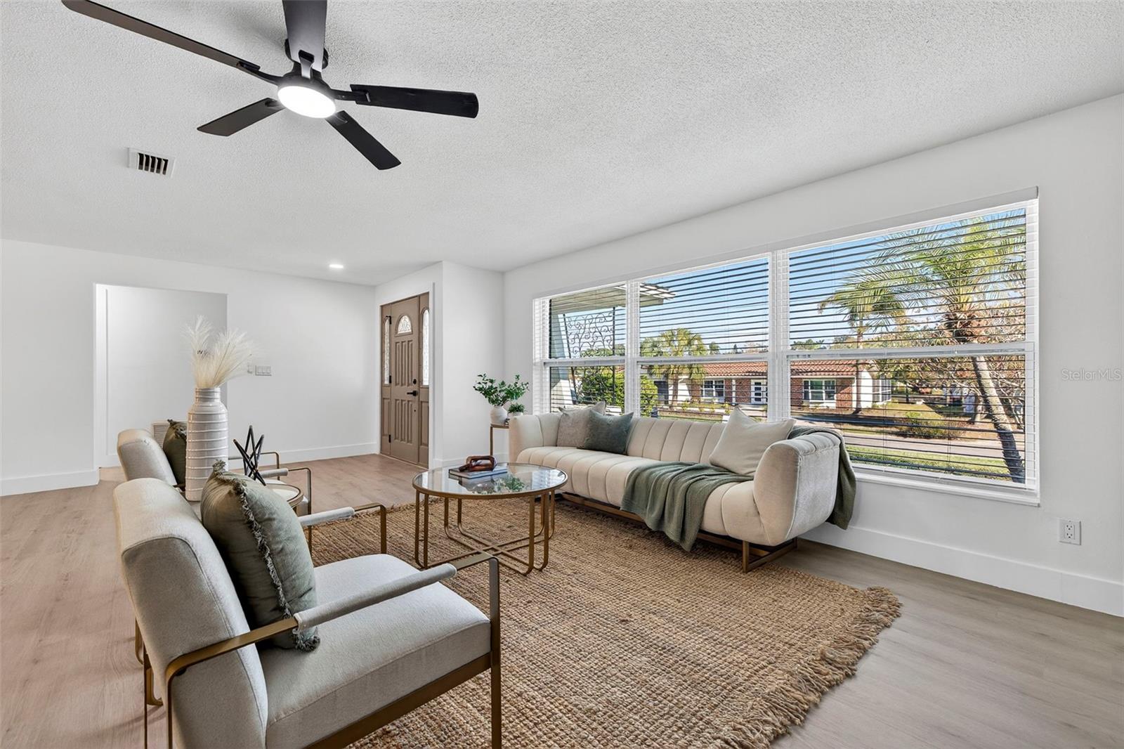 Light-filled OPEN-CONCEPT living space with designer finishes throughout.