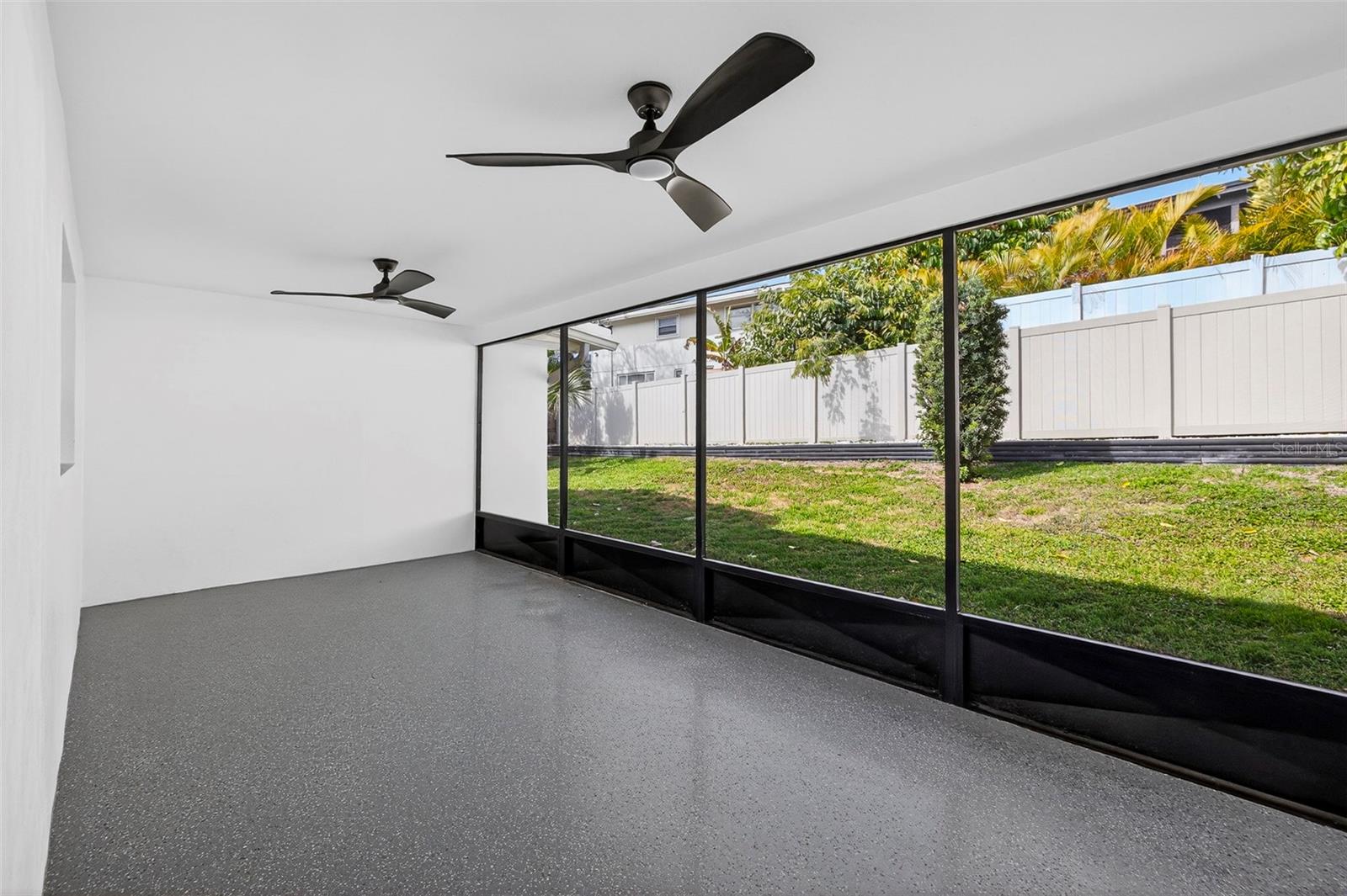 Covered lanai with plenty of room for dining and lounging.