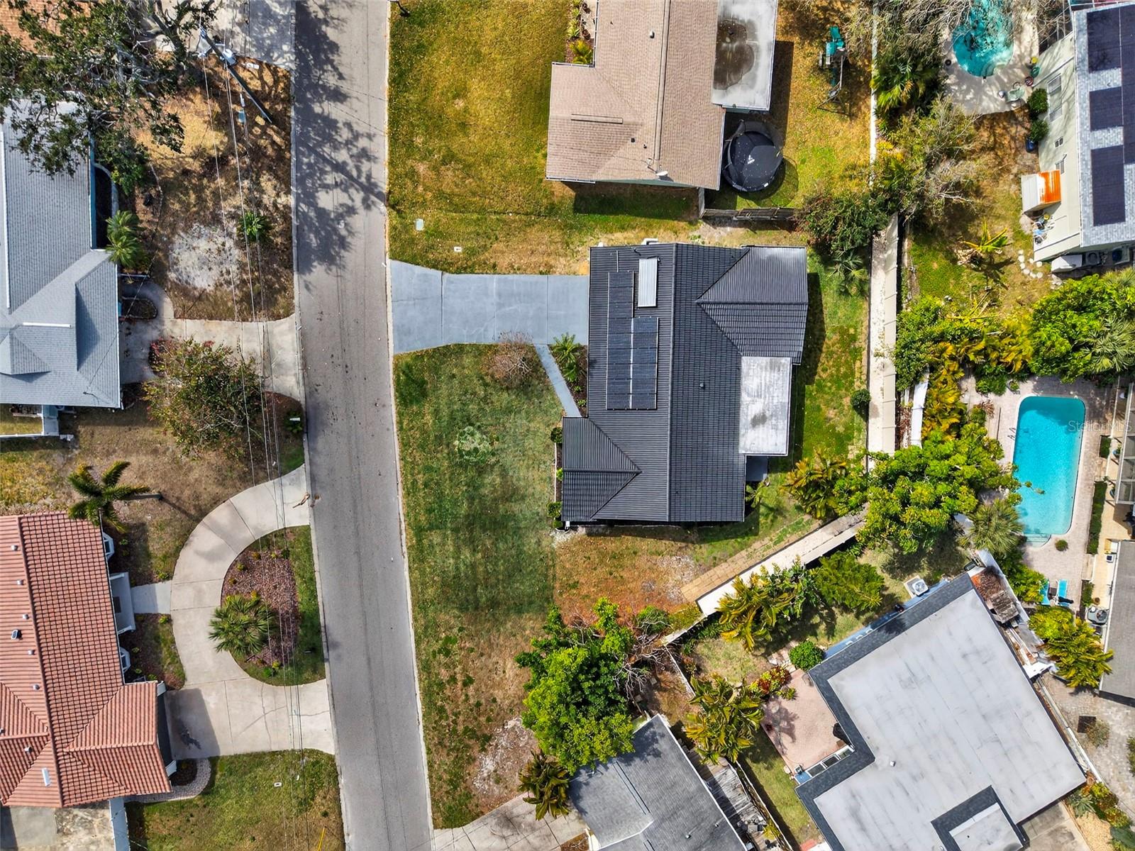 Durable CLAY ROOF with a 50+ year lifespan, paired with cost-saving SOLAR PANELS.