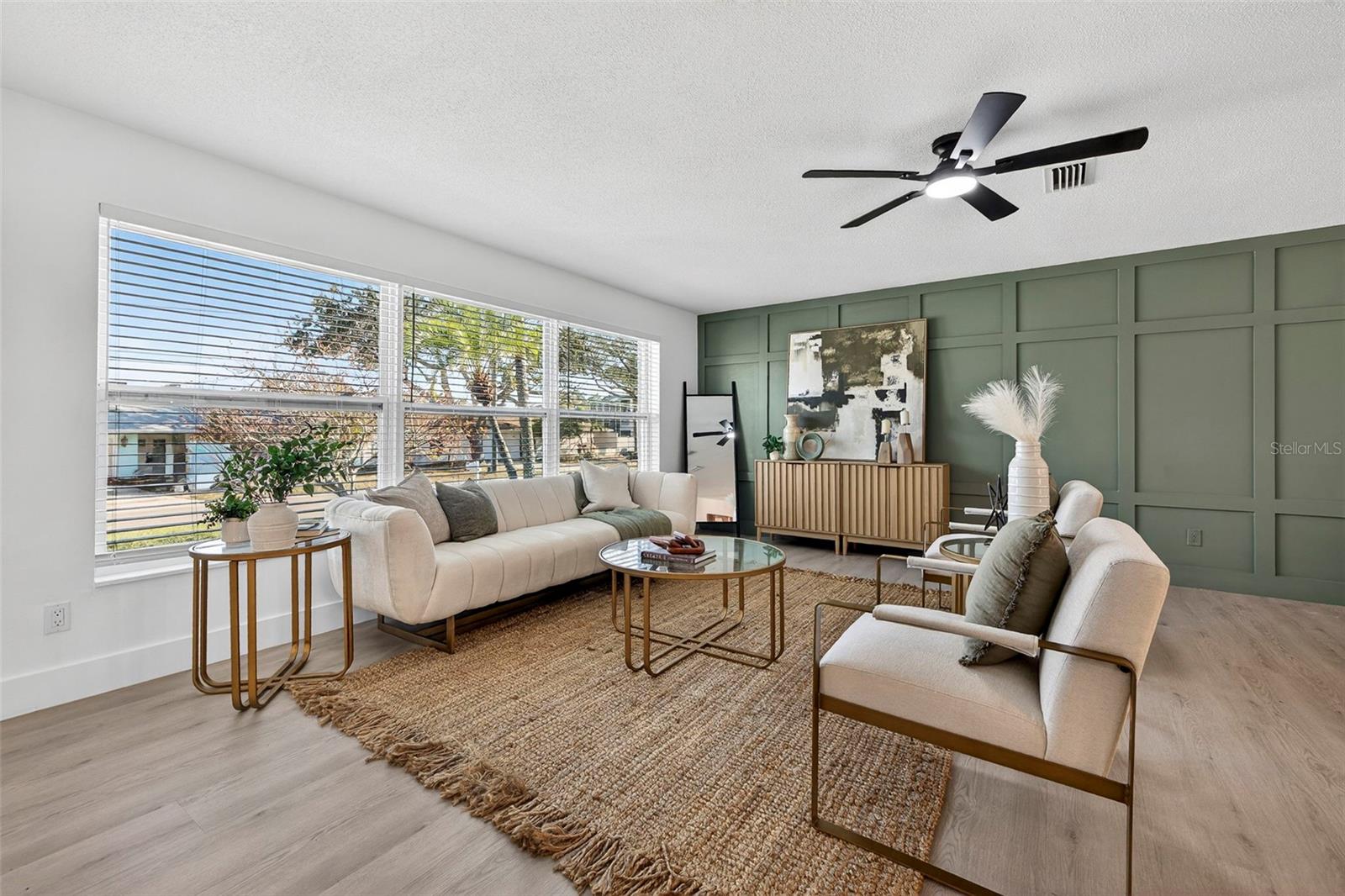 Sage green BOARD AND BATTEN ACCENT WALL adds a stylish focal point.