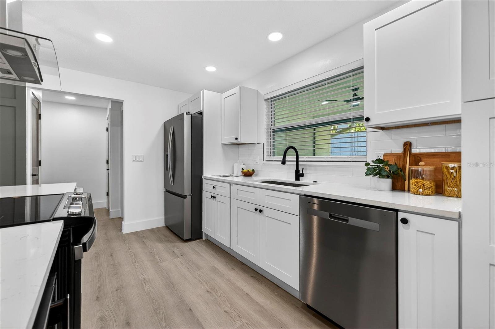 ALL BRAND-NEW STAINLESS STEEL APPLIANCES bring style and function.