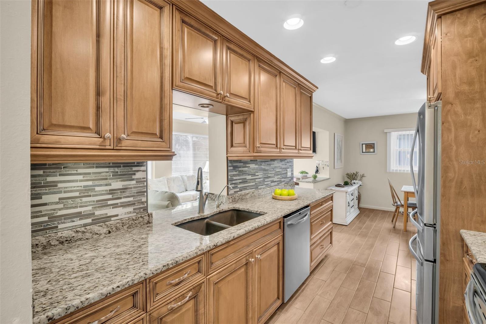 Stunning kitchen renovation with convenient pass-through window to the Florida room~