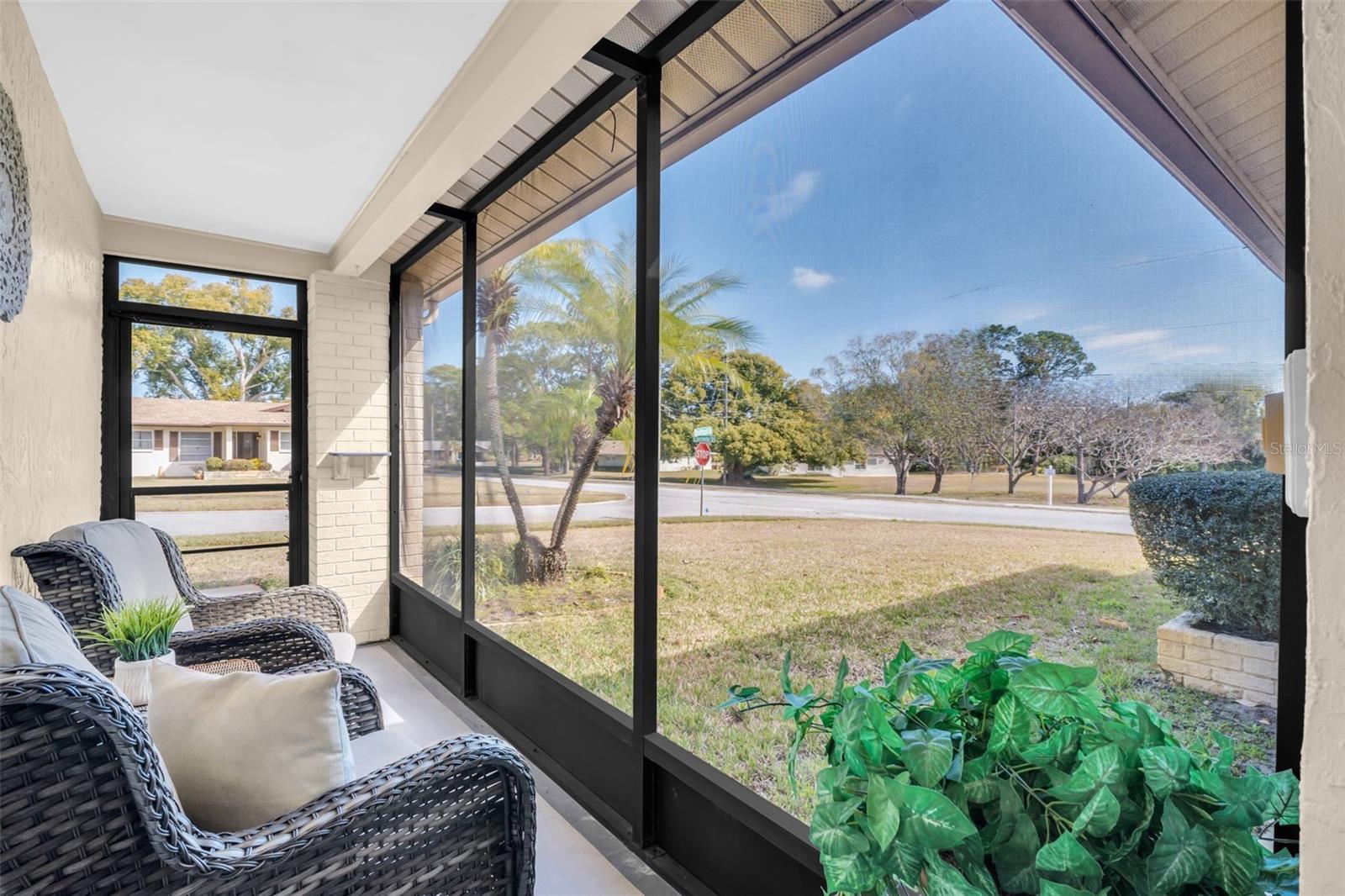 Front screened lanai for year-round enjoyment and allows you to leave the front door open for a breeze inside~