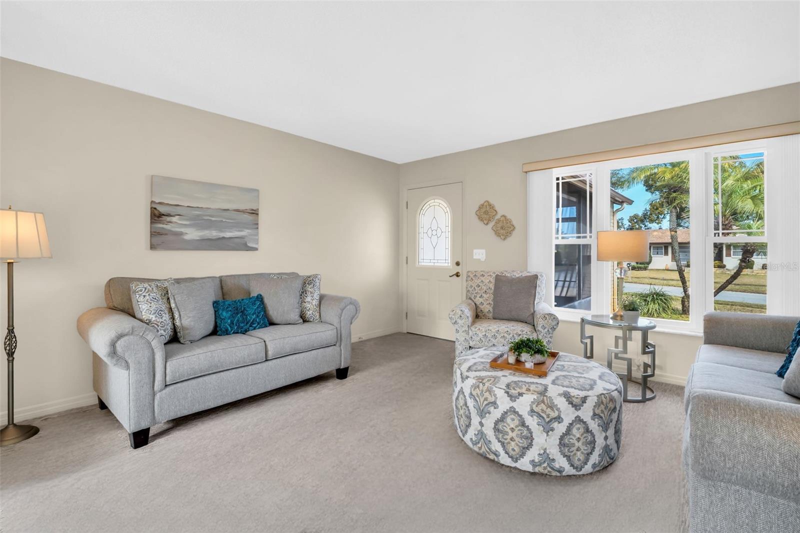 Updated glass front door & dual pane windows with hurricane shutters~