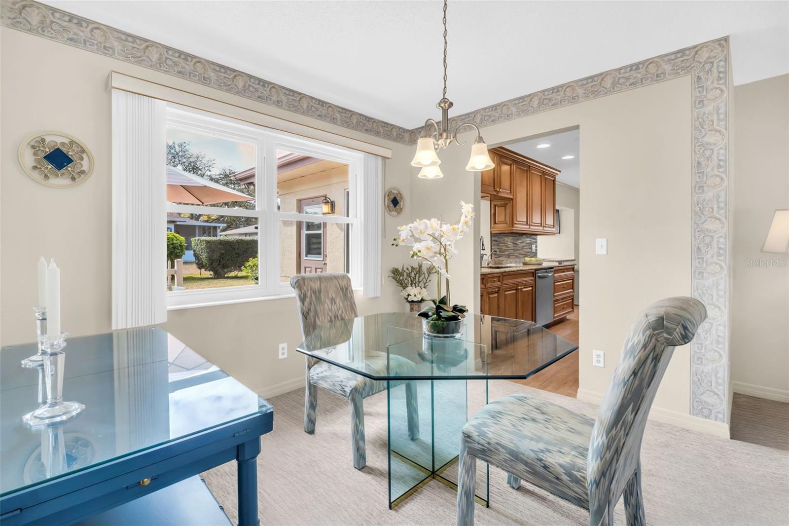 Casual dining off the kitchen with green backyard views~
