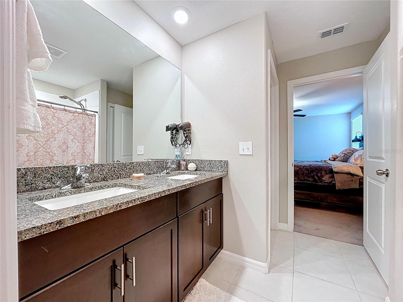 Primary bathroom has double sinks, and thick granite, and plenty of storage!