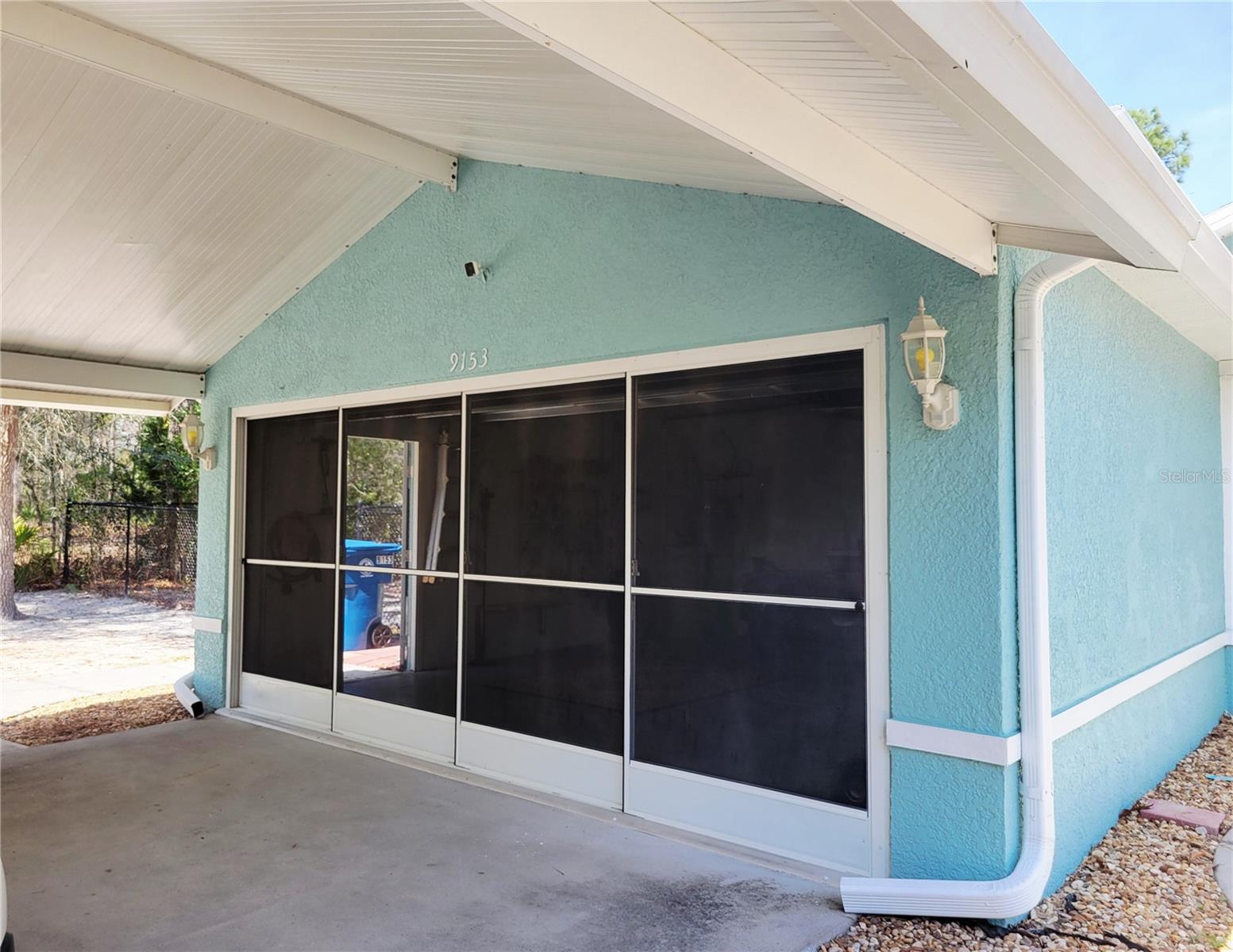Sliding screened in garage