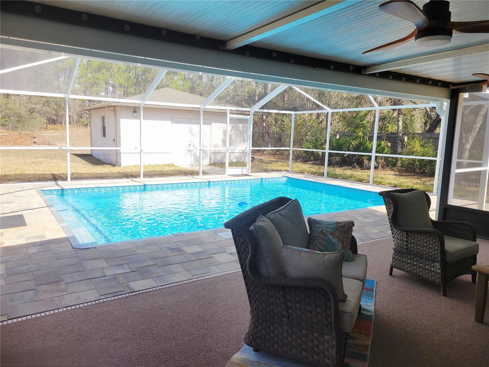 French doors lead out to your pool area