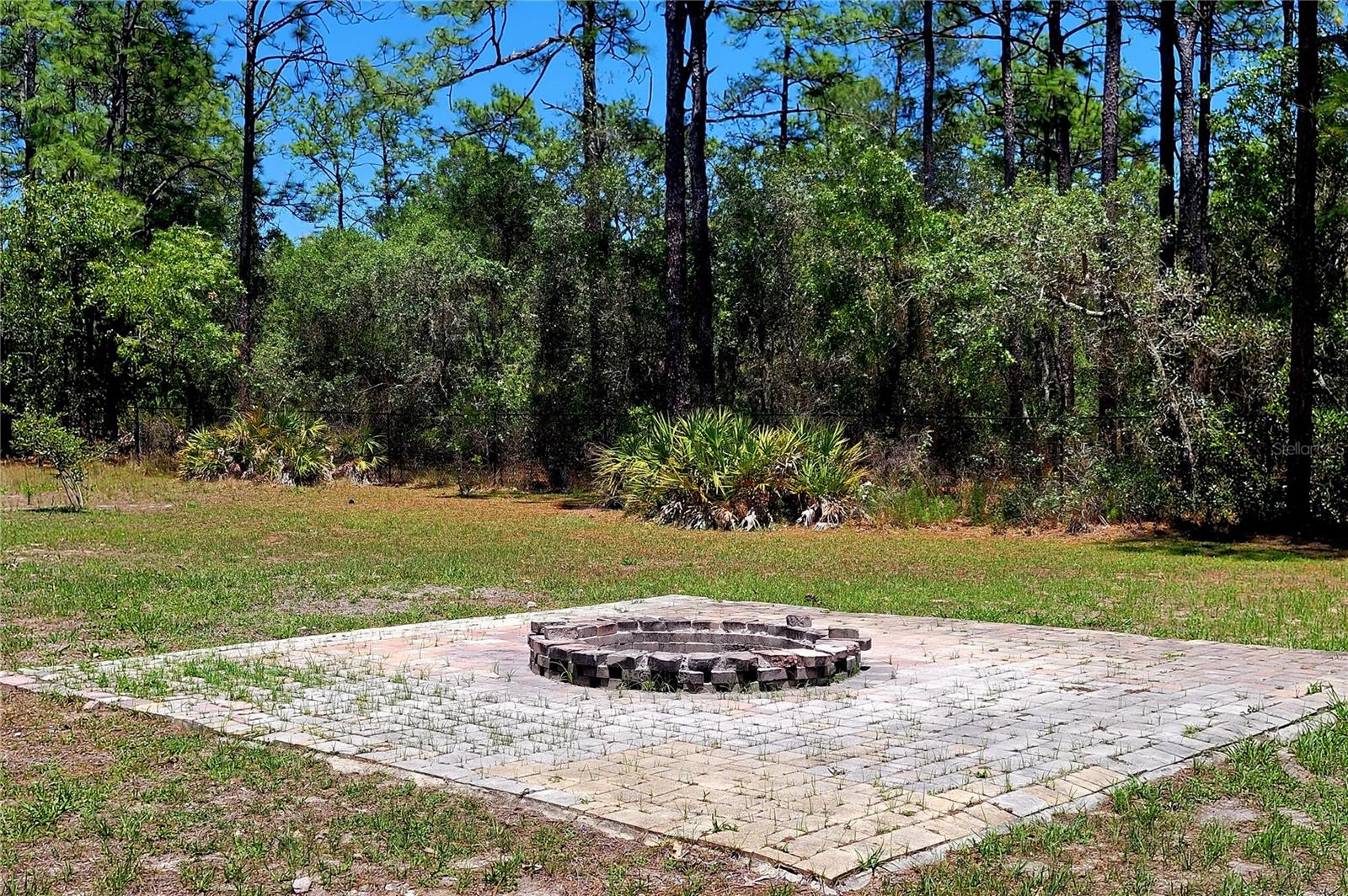 Enjoy a beverage by your Paver Firepit on those cooler evenings