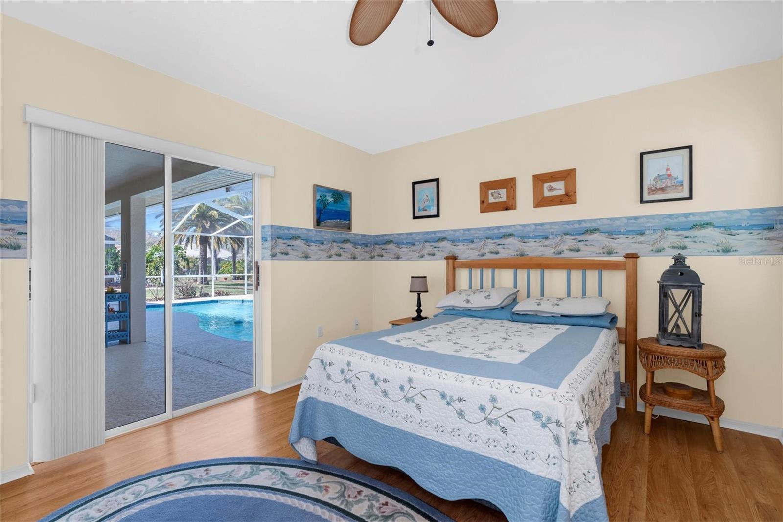 Bedroom #3 - Sliding glass doors to the pool/covered lanai