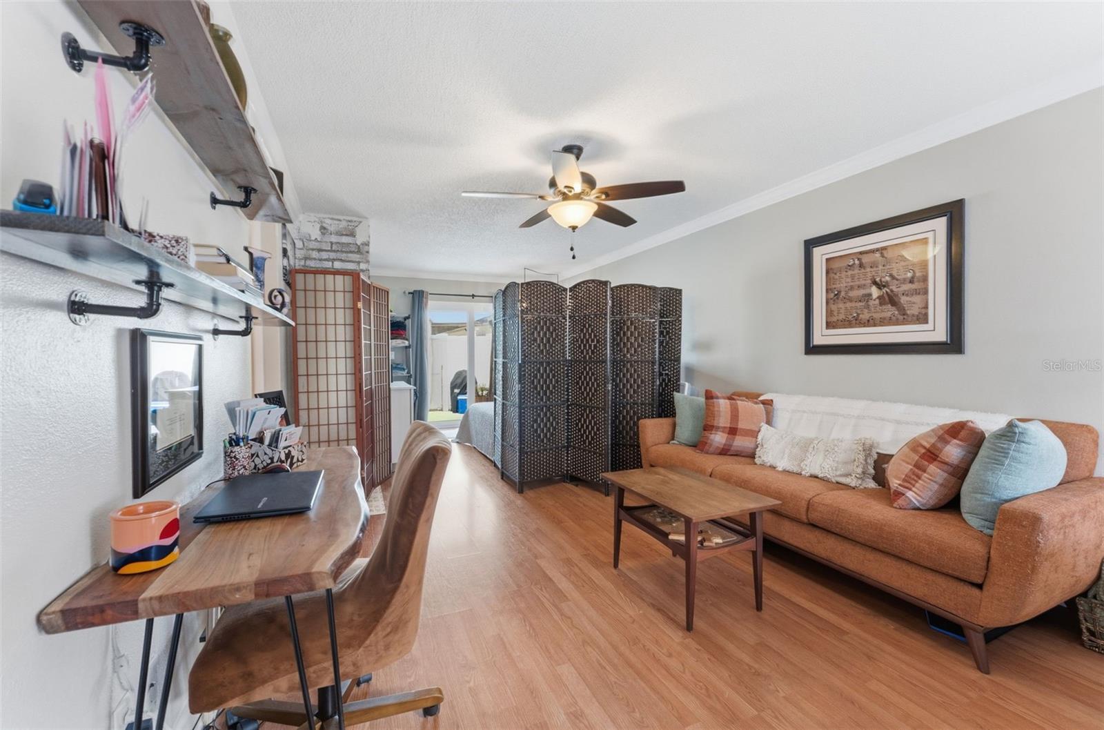 Versatile and spacious living room currently sectioned to create an additional bedroom area — or easily open it back up for an expansive, oversized living space perfect for relaxing or entertaining.