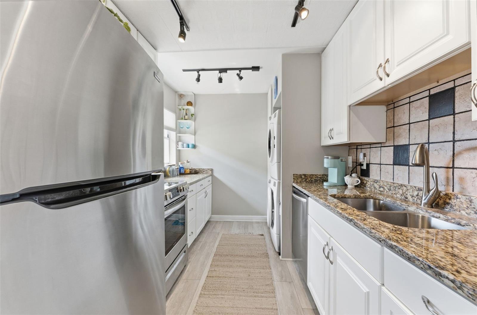 Updated kitchen with modern finishes and great functionality.