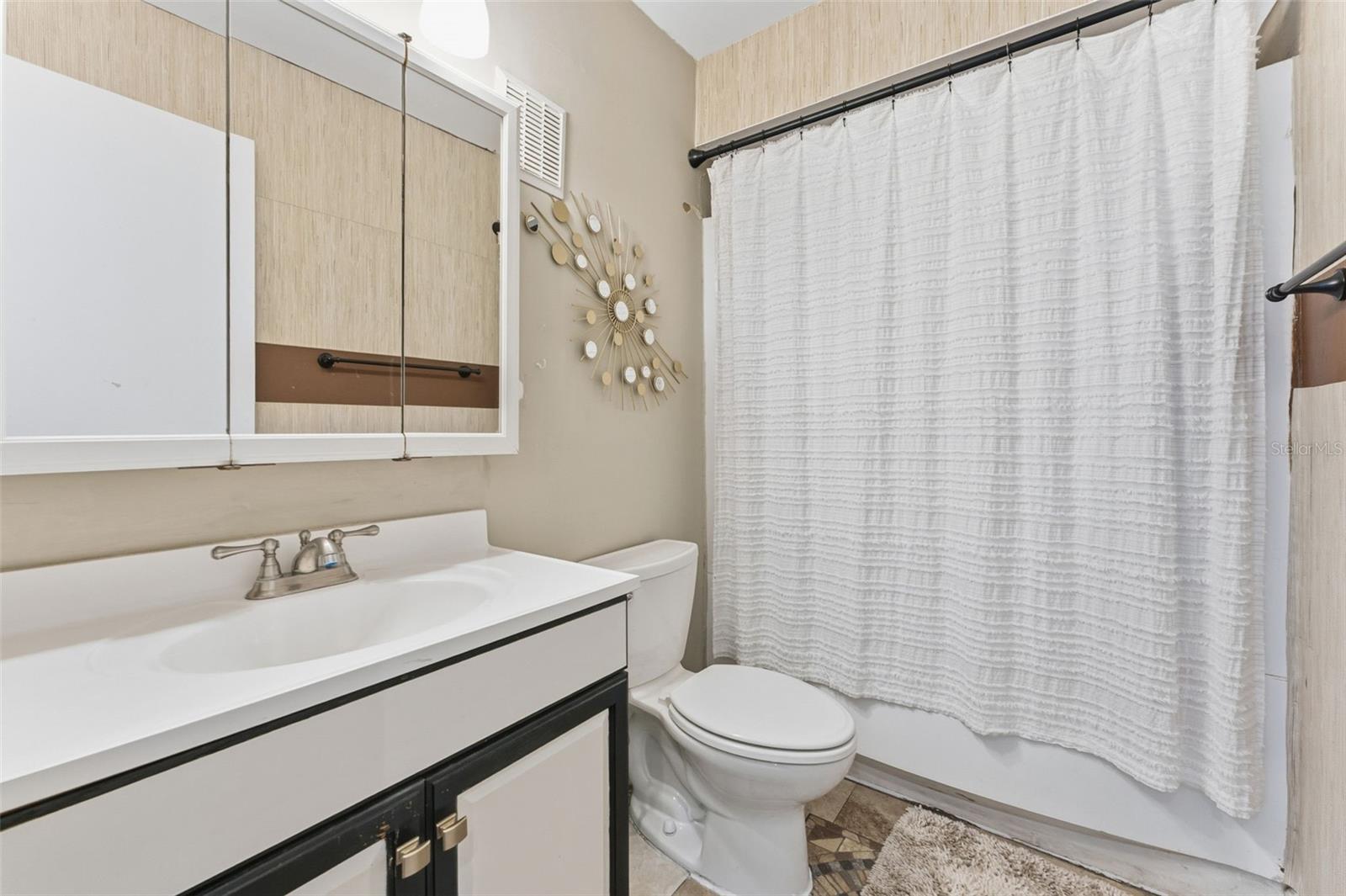 Updated bathroom featuring a tub/shower combination.