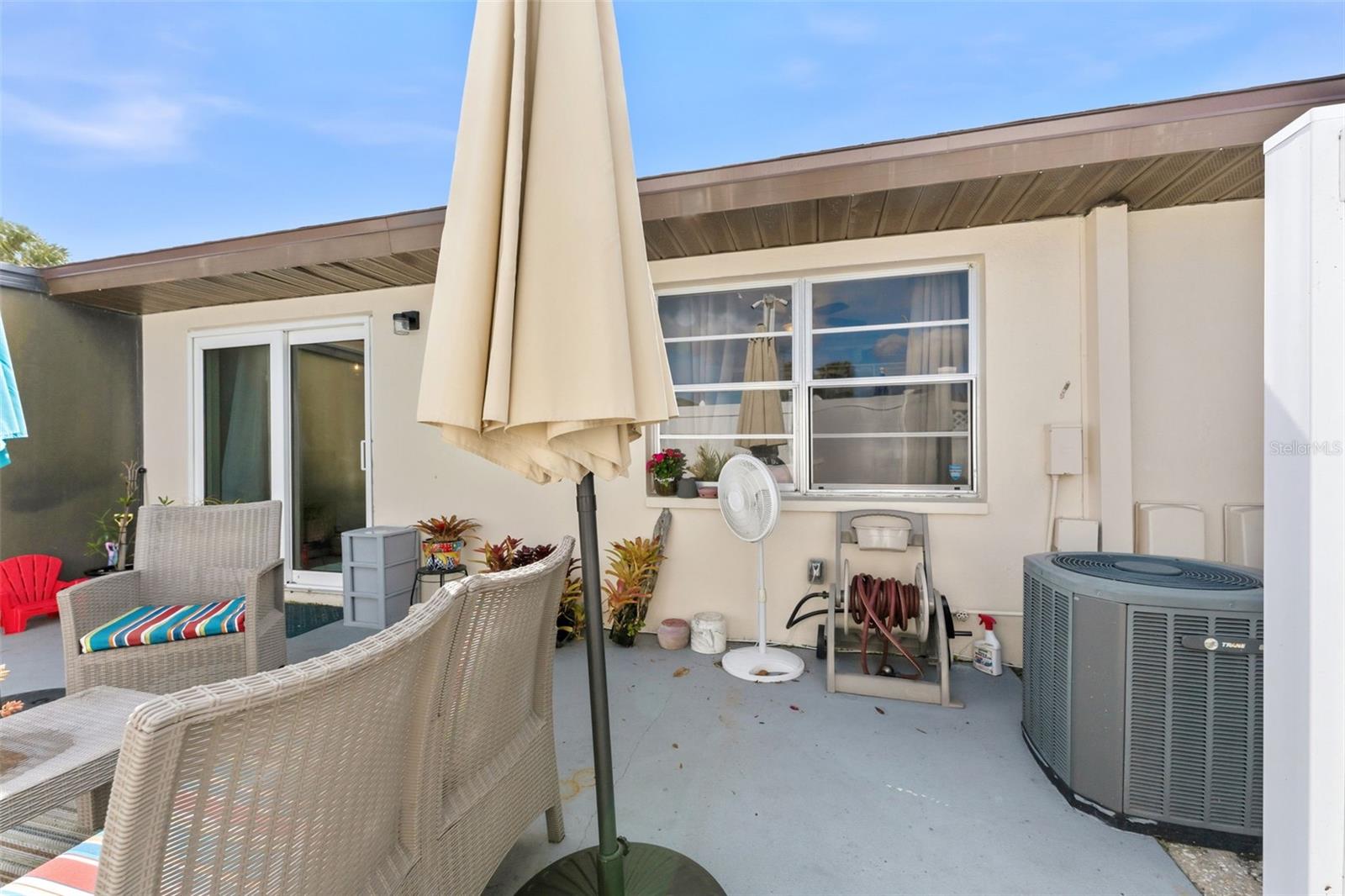 Ideal space for outdoor seating or container gardening.