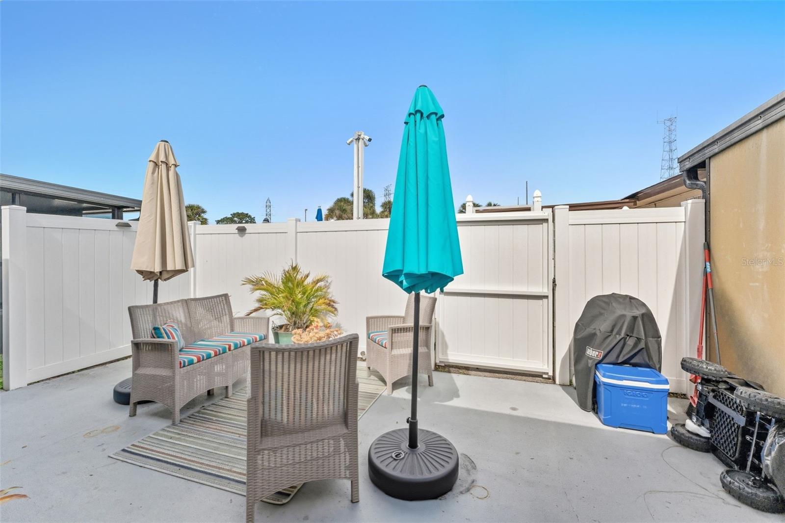 White vinyl fencing adds privacy and charm.
