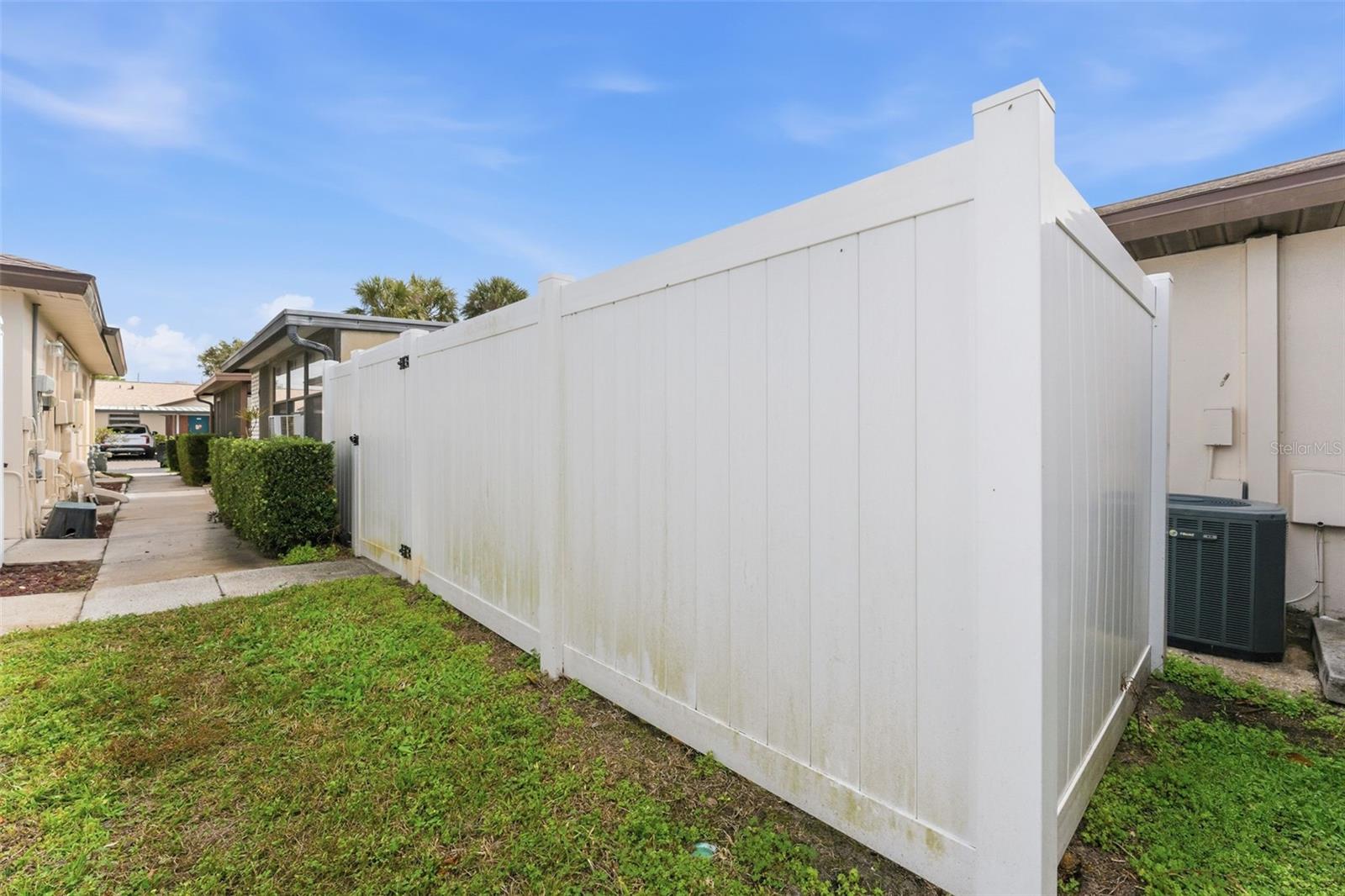 White vinyl fence offers a clean look and outdoor privacy