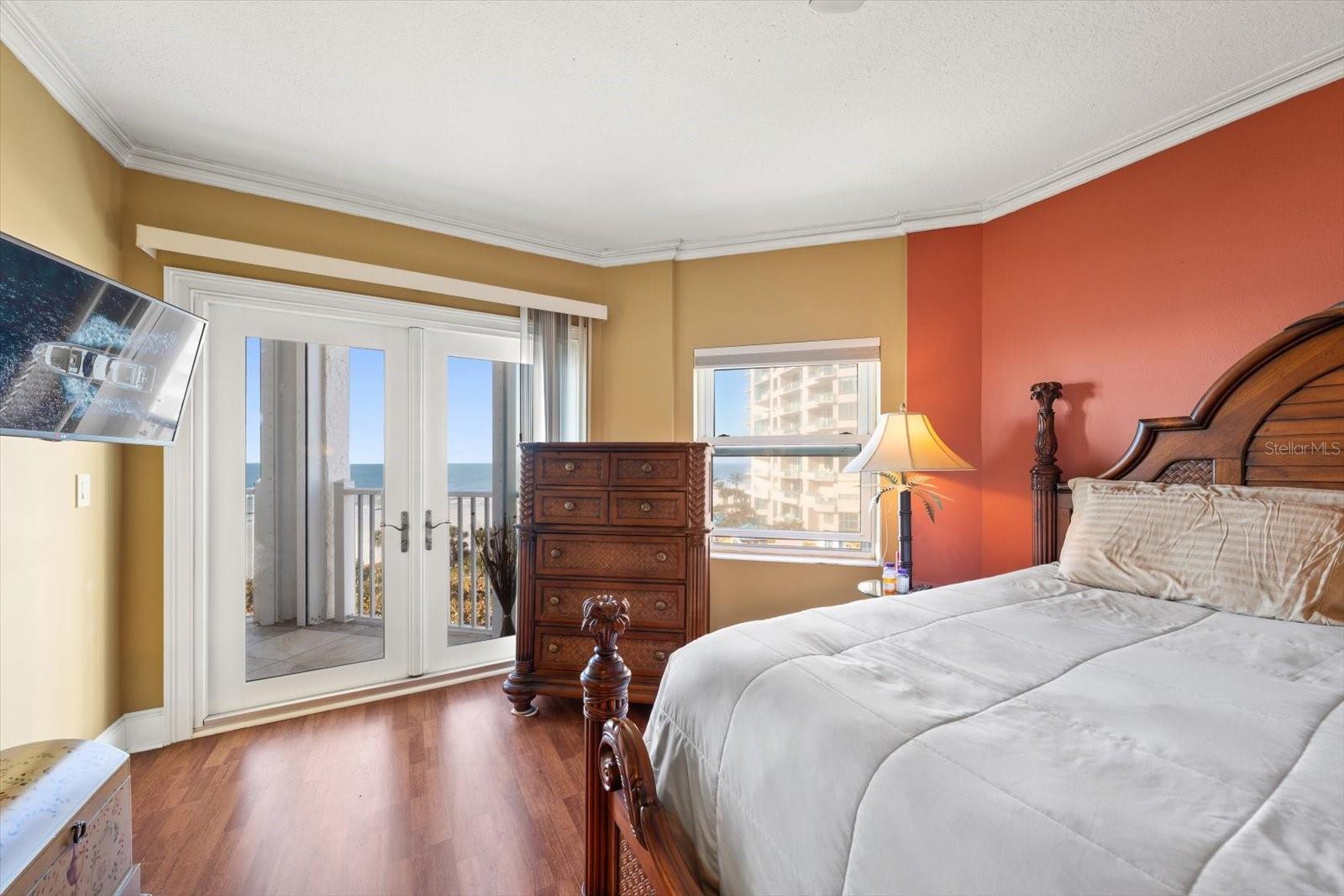 Primary bedroom offering gulf front views and access to the terrace.