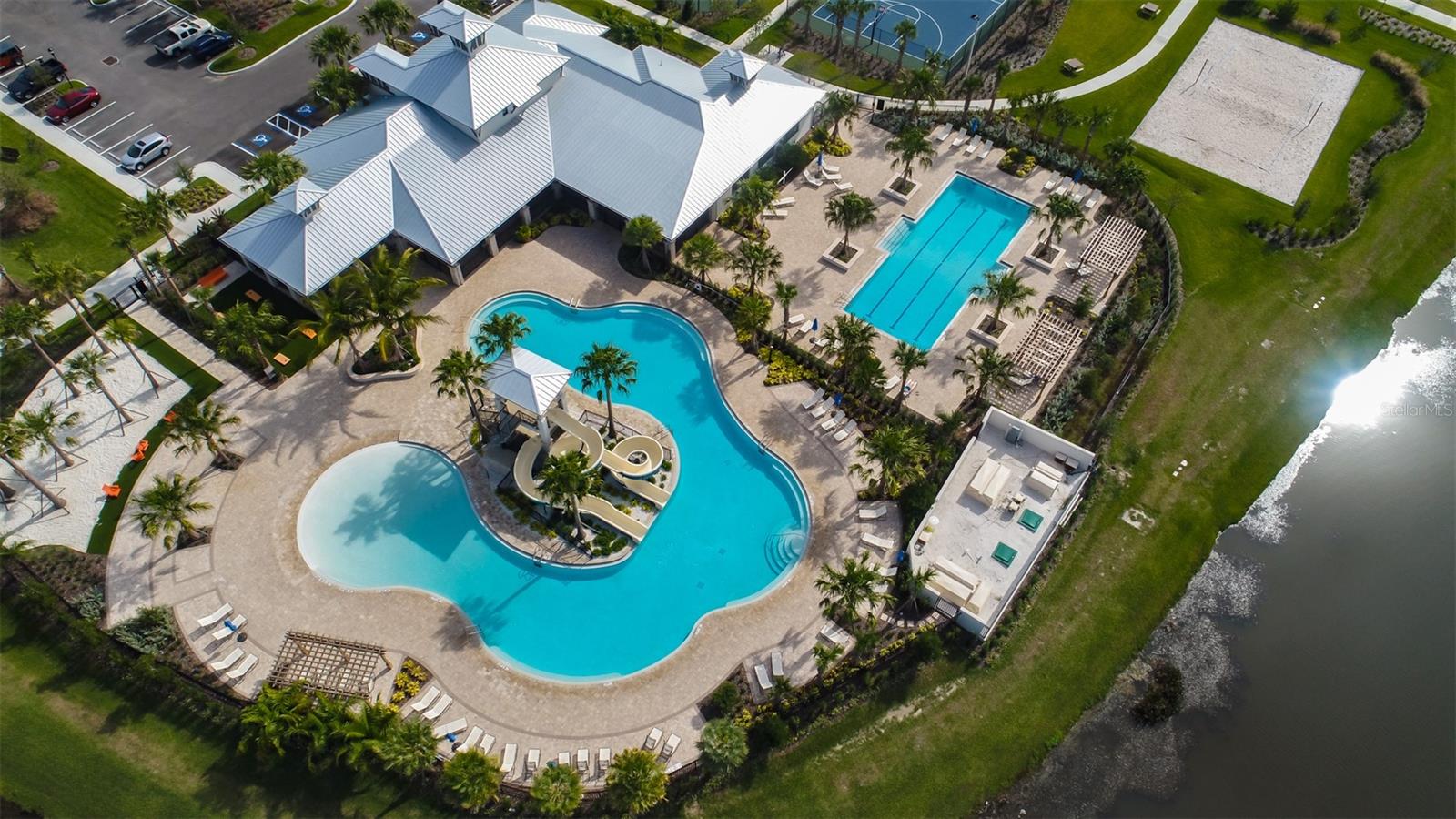 AERIAL OF 2ND CLUBHOUSE, FAMILY "SLIDE" POOL AND LAP POOL