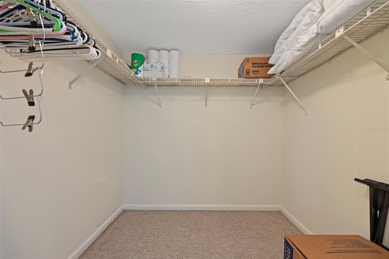 Primary room walk in closet