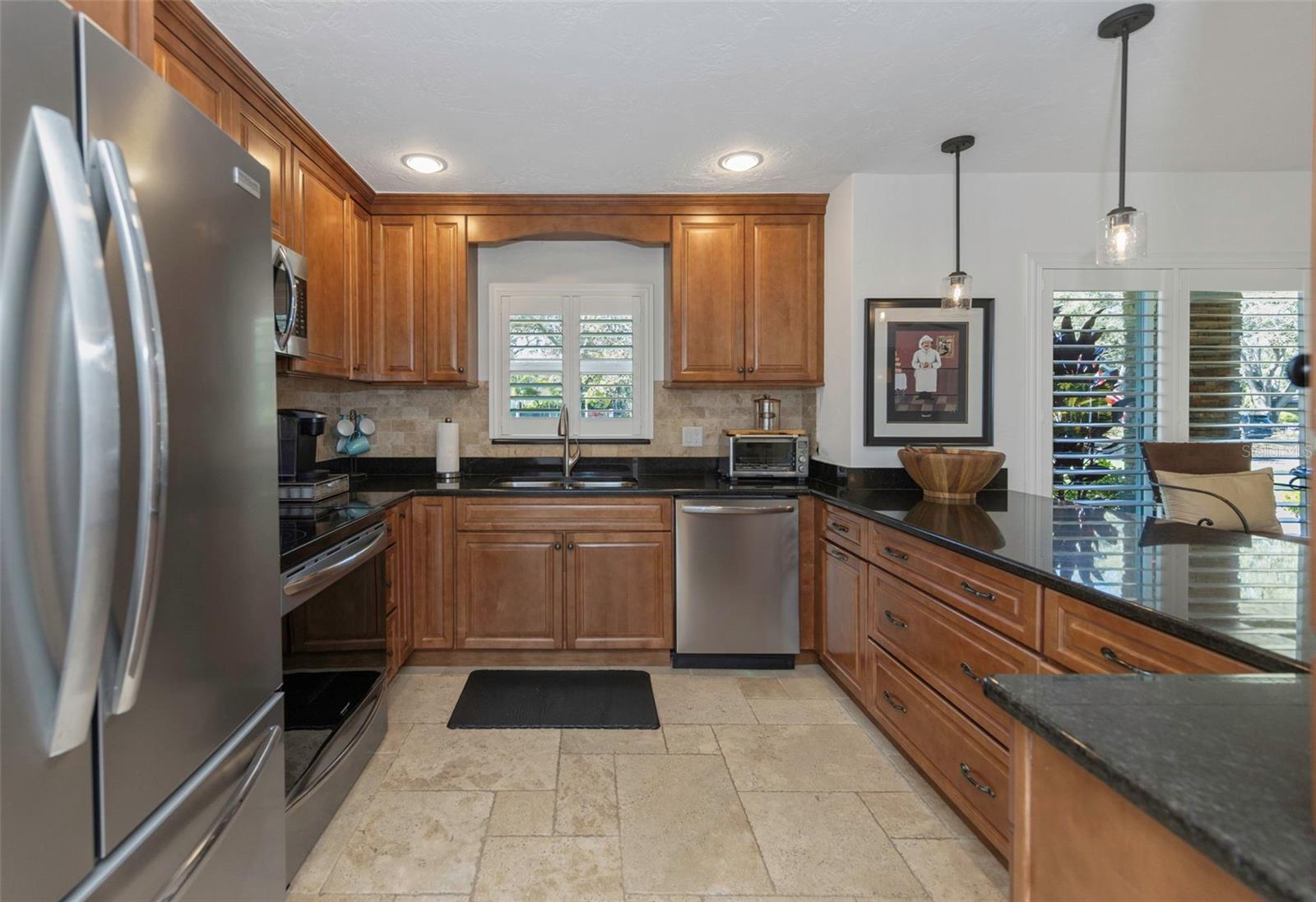 Custom all Wood Cabinetry - plenty of storage a pull out shelving & drawers!