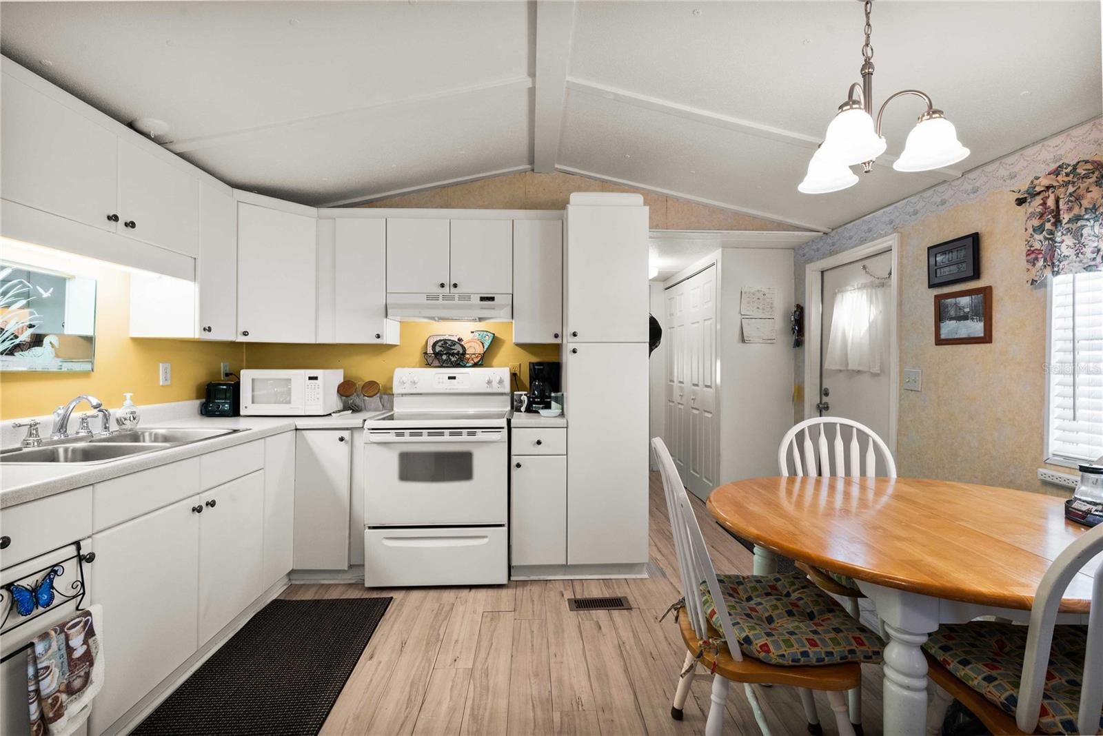 Kitchen is open with living room.