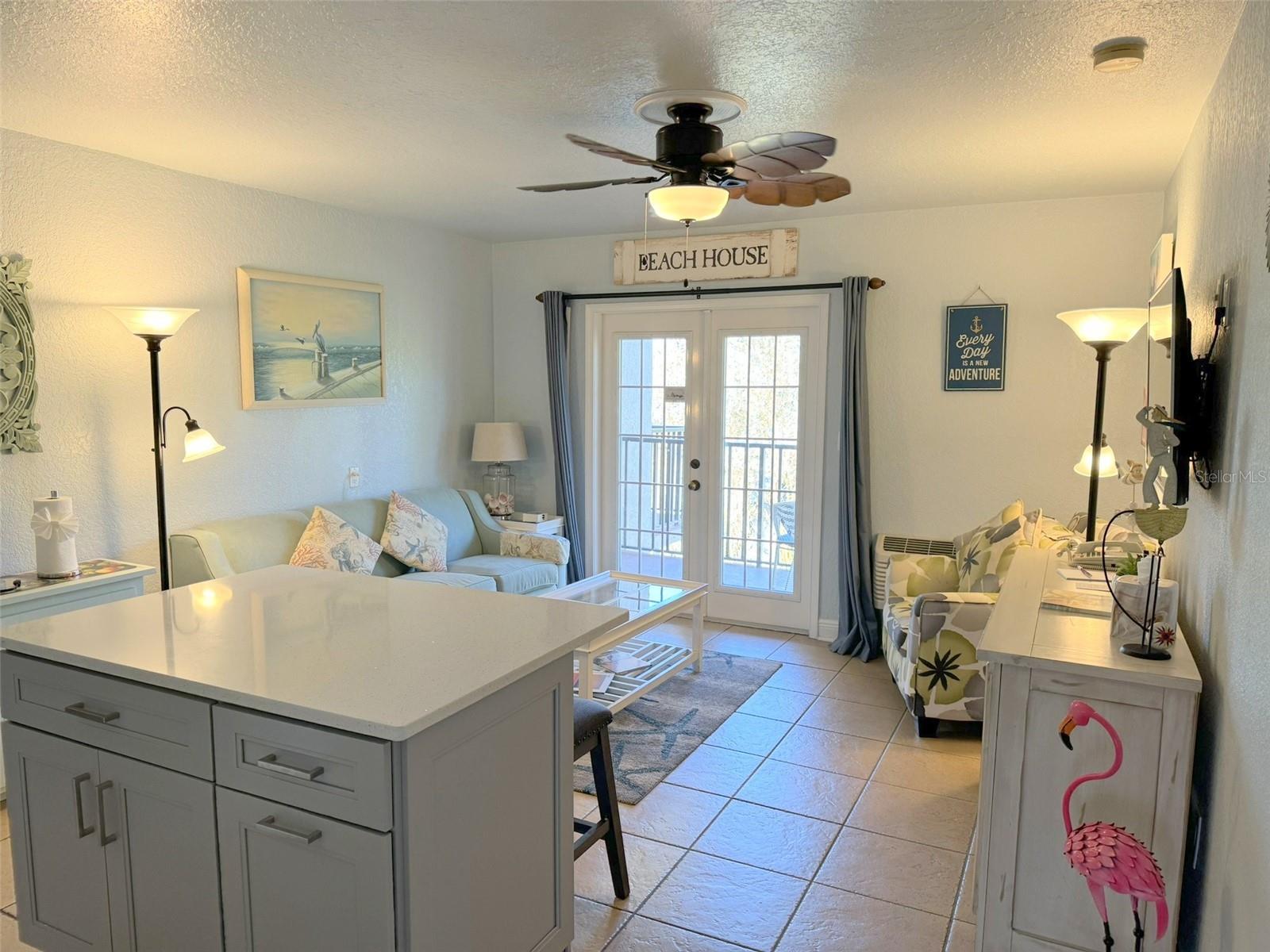 Living area open to French door and Patio