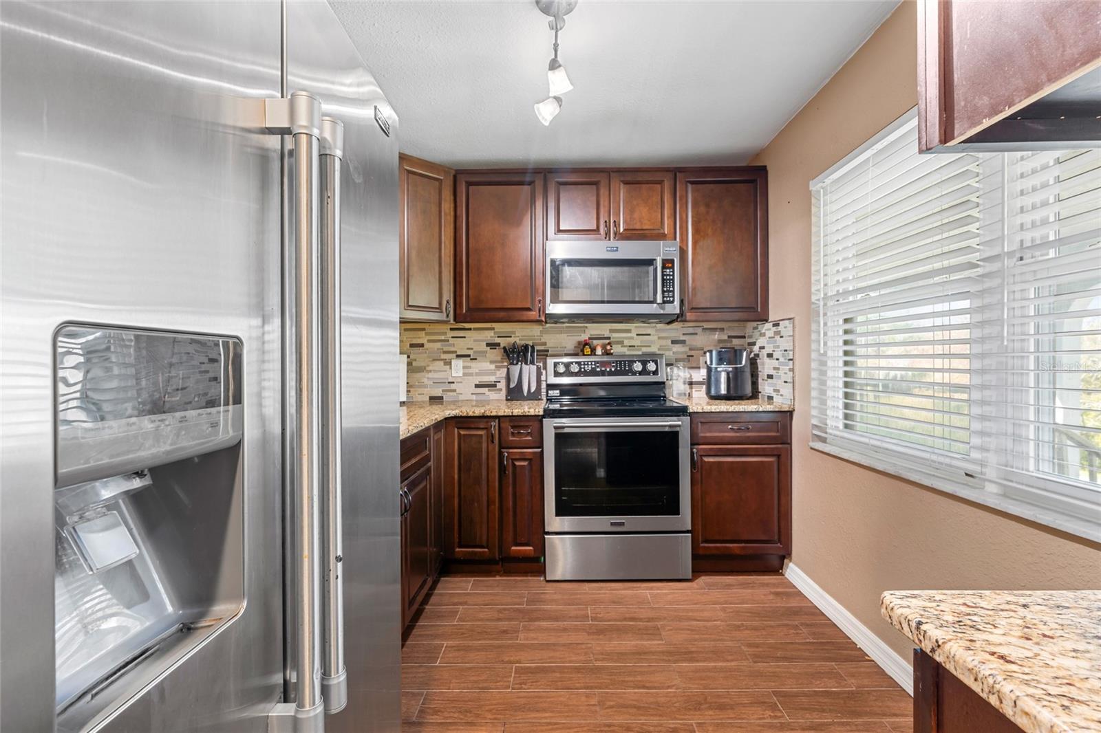 Stainless steel appliances in Kitchen