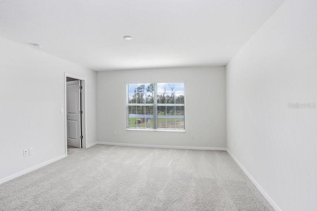 Primary Bedroom with Big Walk-in Closet! (picture of model home)