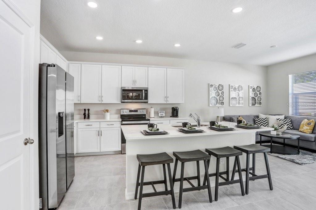 Big Kitchen Island with Quartz Countertops (picture of model home)