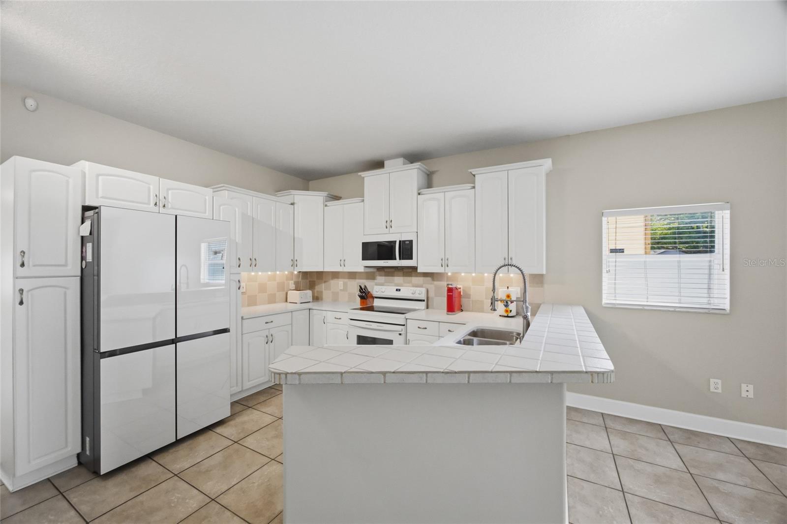 Spacious Kitchen with Bespoke Appliances.
