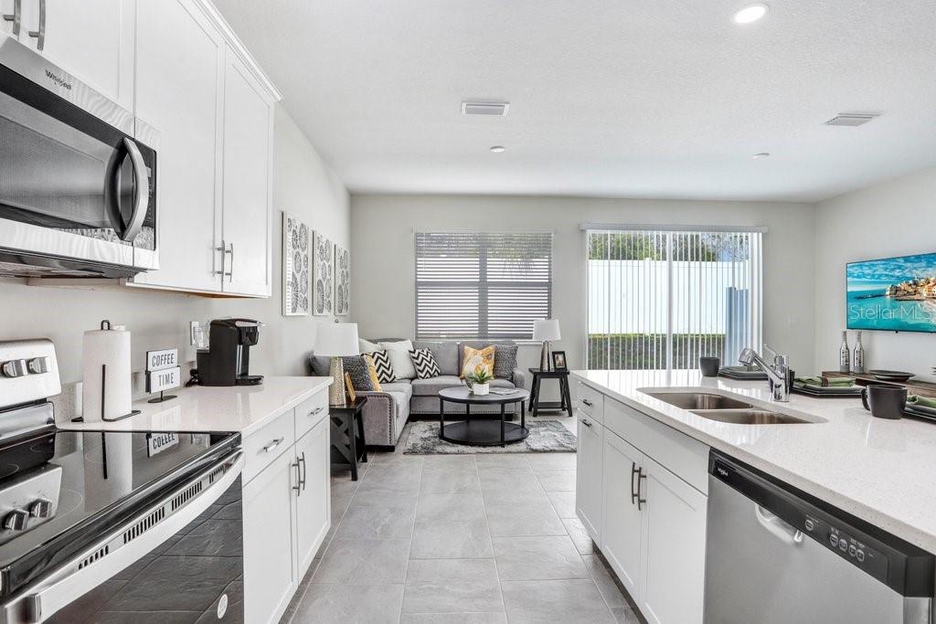 Great Room with Sliders out to Patio (photo of model home)