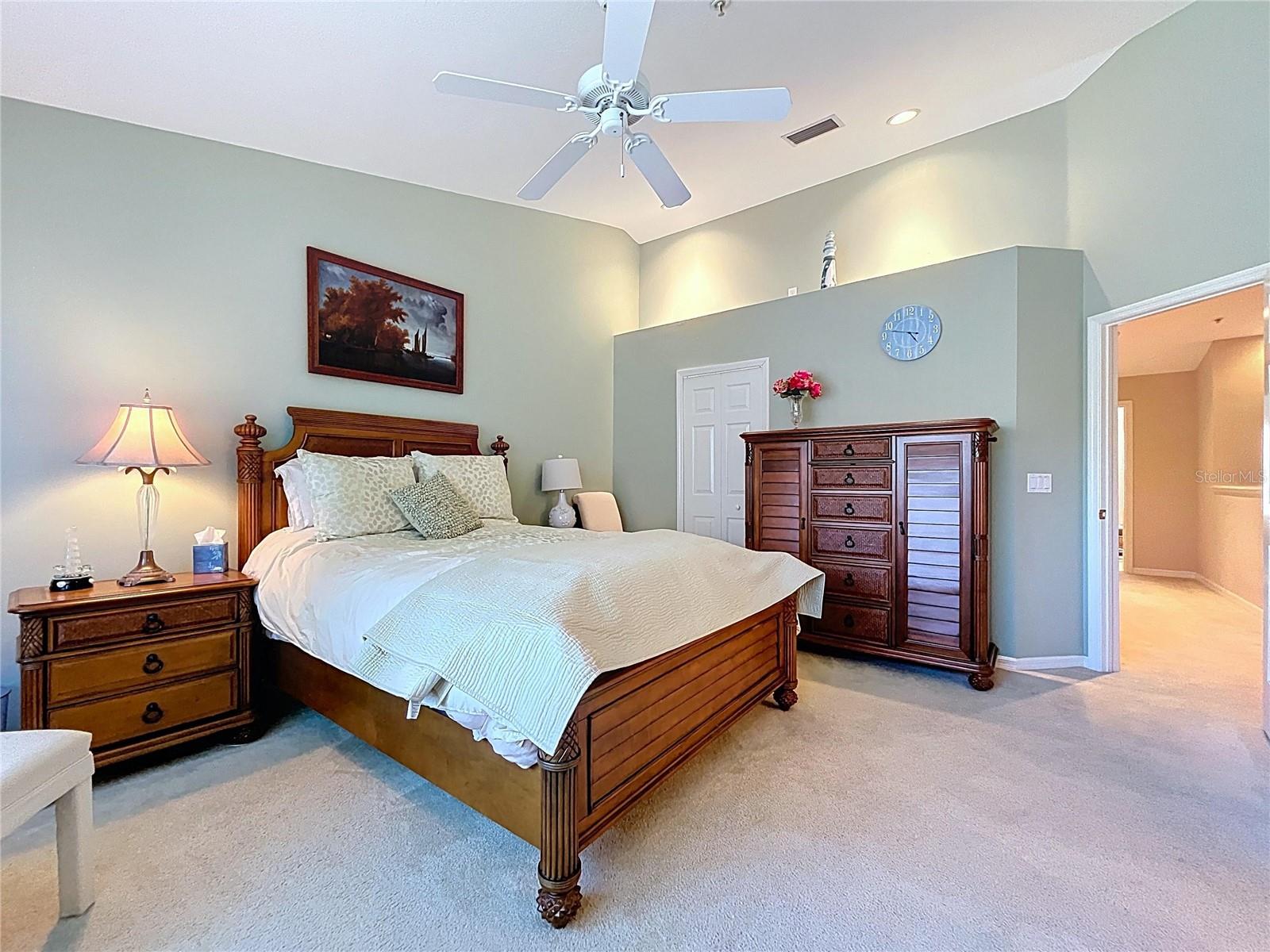 The Primary bedroom is spacious with vaulted ceilings and a large walk-in closet.