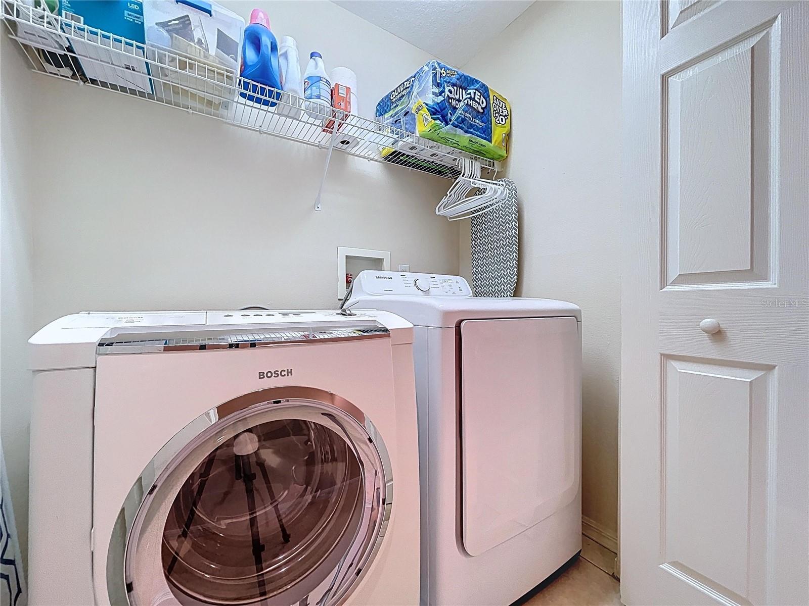 Second floor laundry closet is conveniently located between the bedrooms.