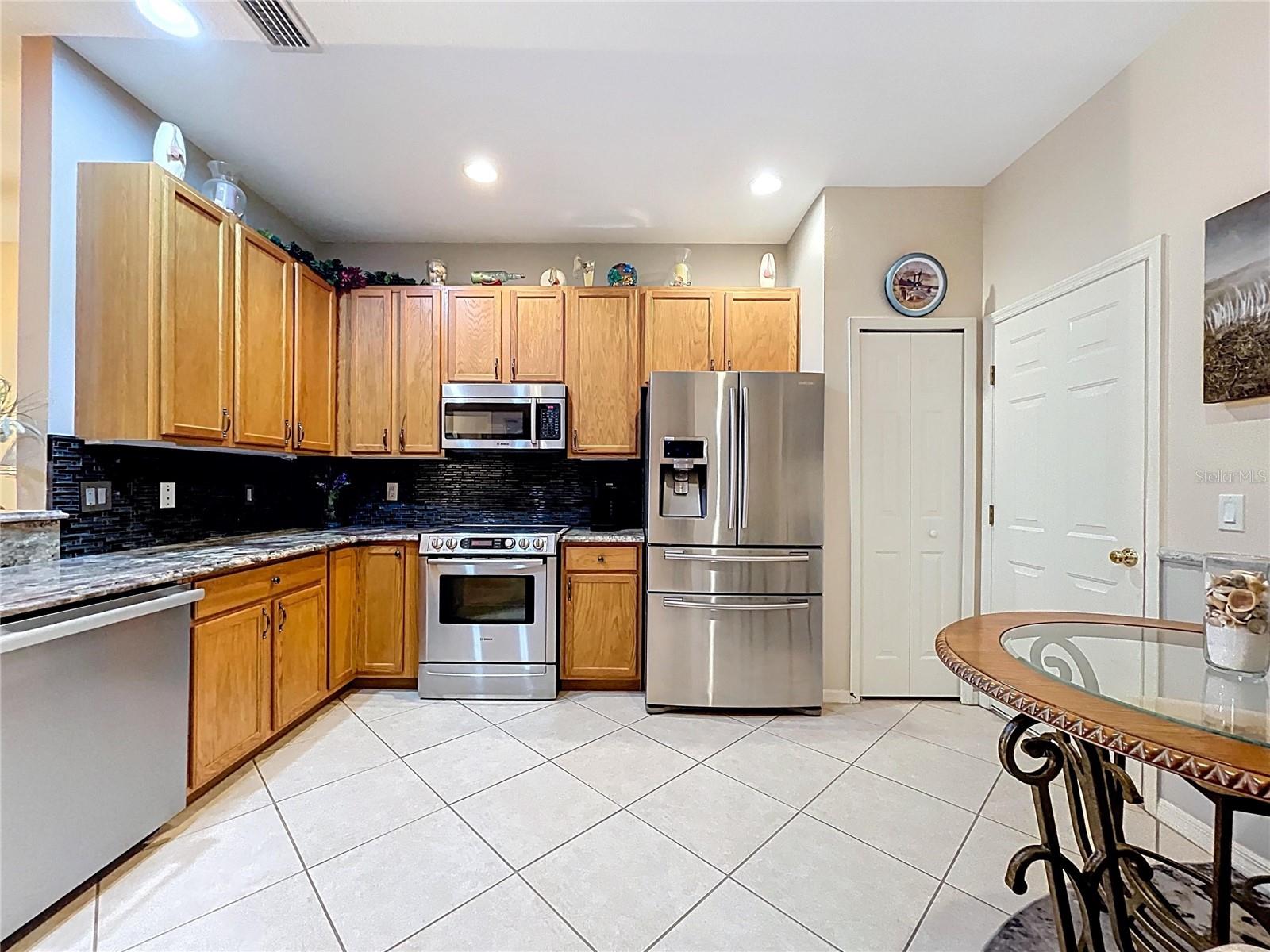 Breakfast nook in the kitchen along with a pantry closet.