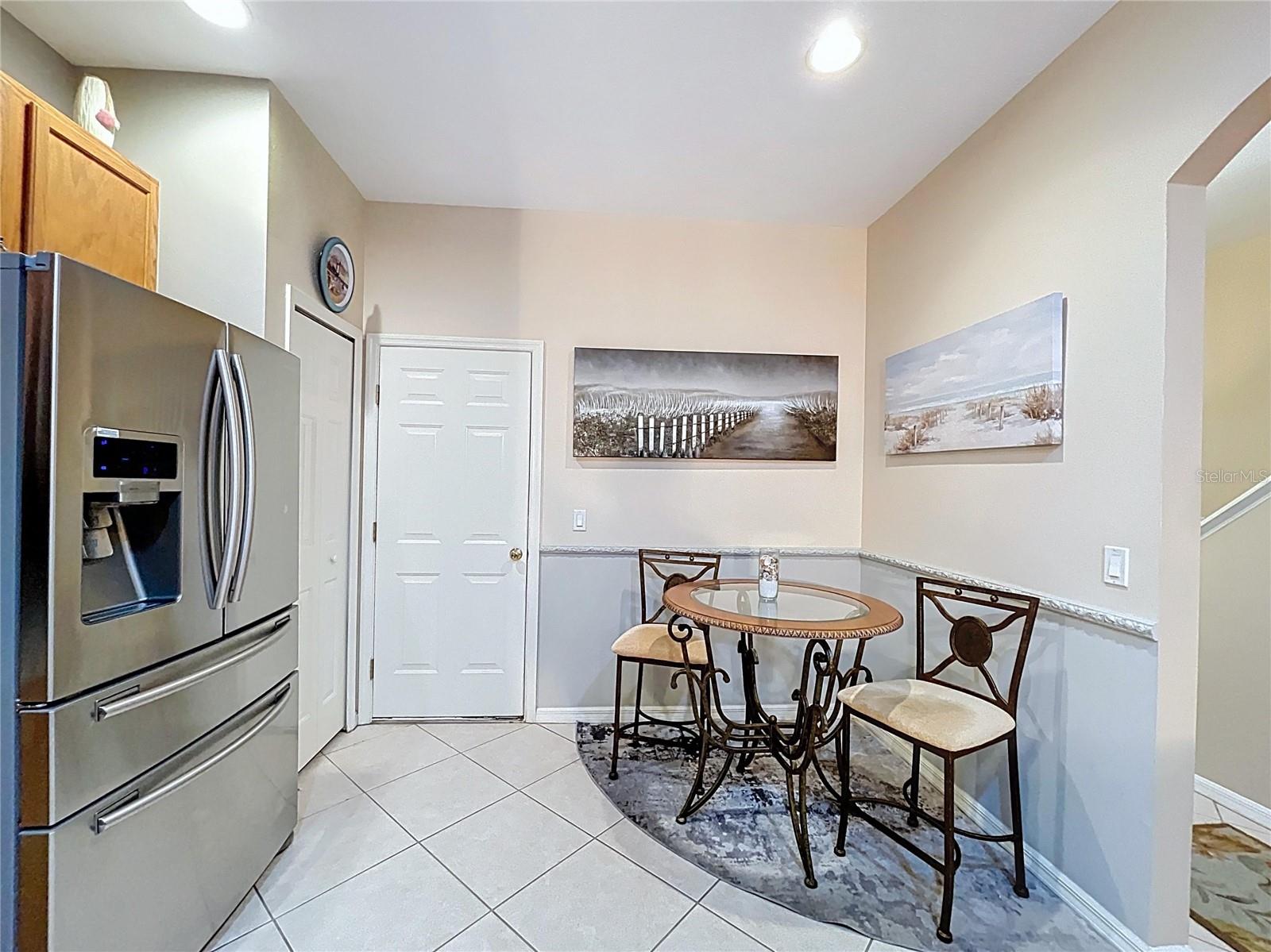 Breakfast nook in the kitchen along with a pantry closet.