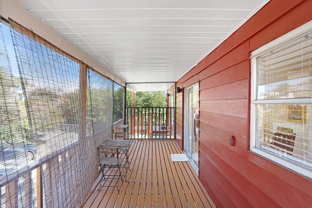 DECK OFF DINING ROOM FACING FRONT DOOR