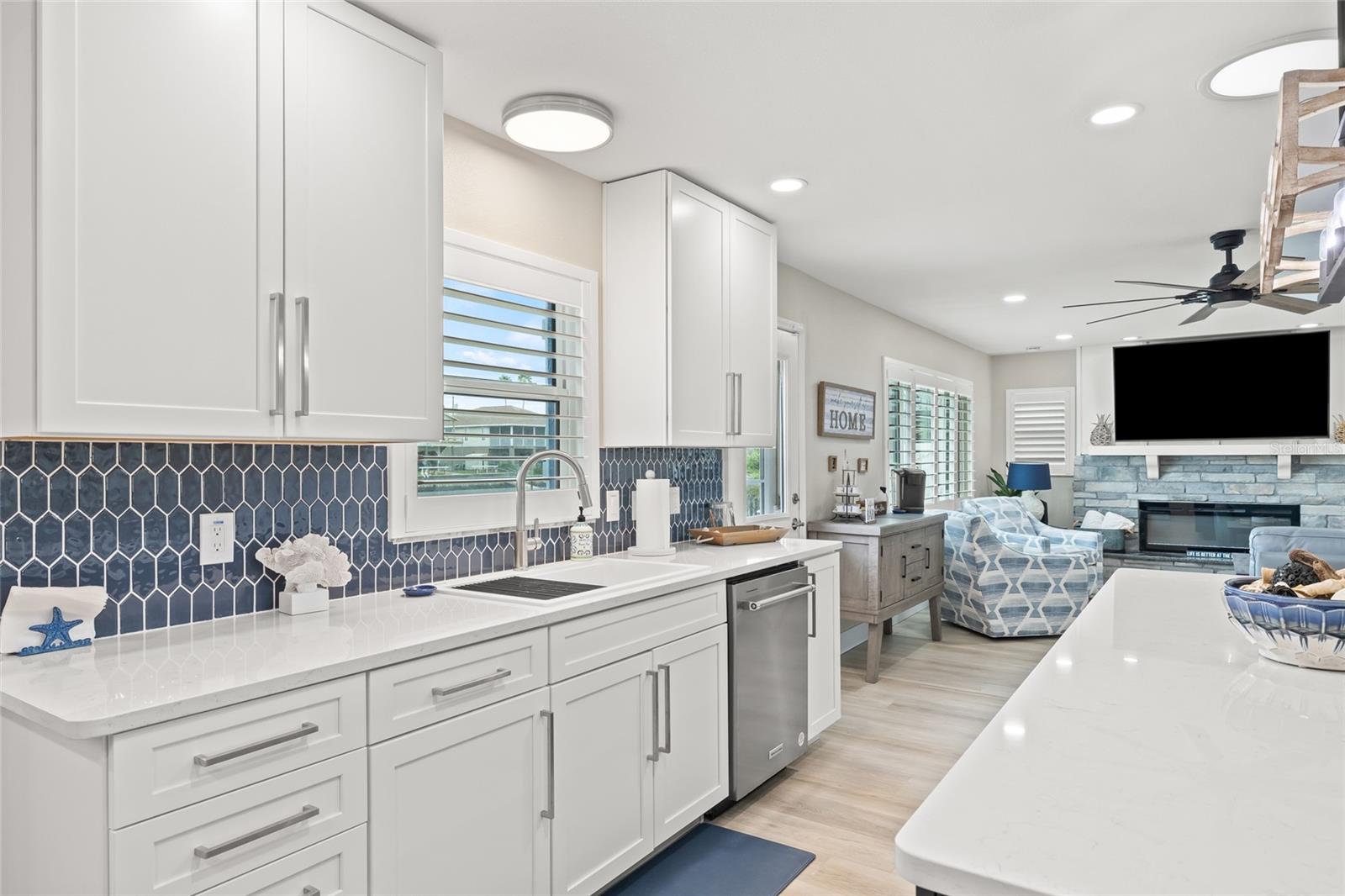 Quartz Countertops with Blue Tile Backsplash