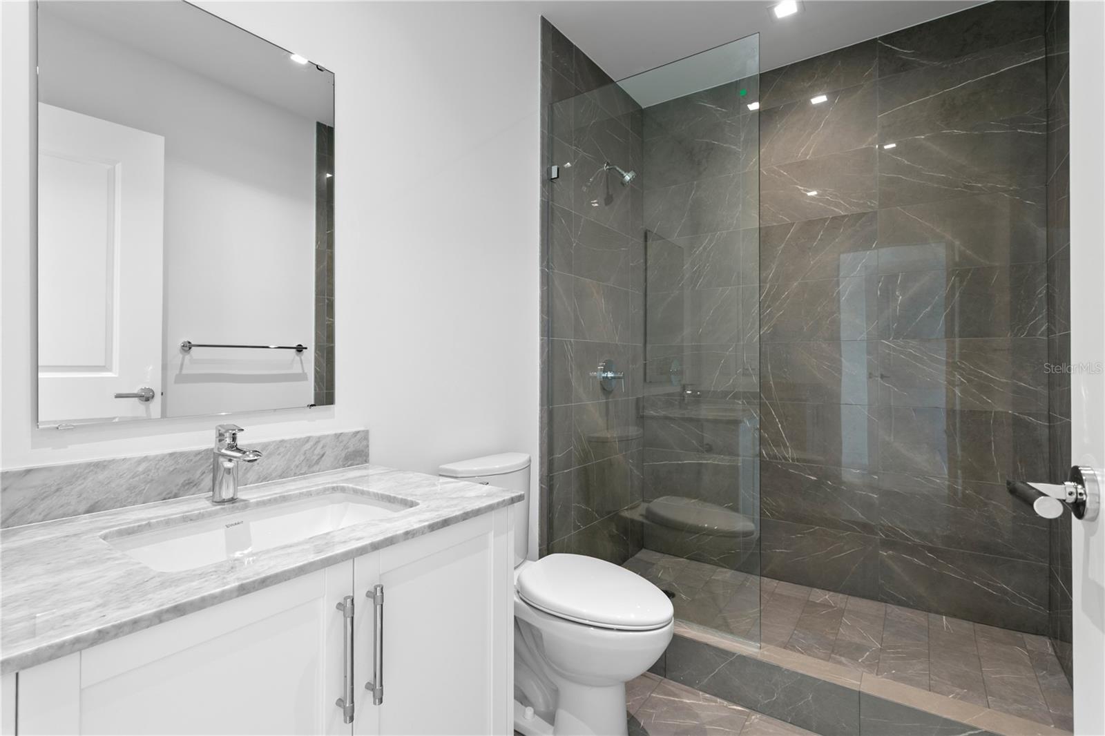 Ensuite bathroom in second bedroom and just off the office/study/den flexible space