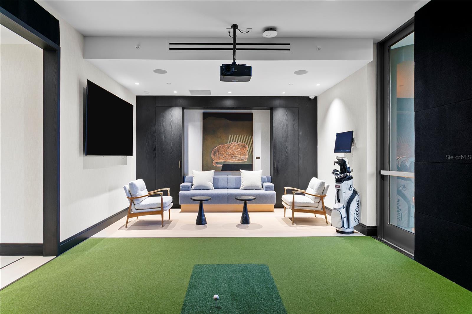 Golf simulator and lounge